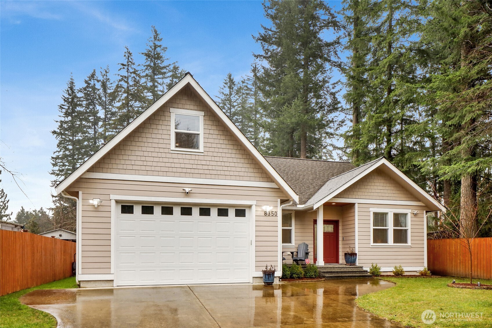 Discover the perfect blend of modern luxury and future potential on this pristine .51-acre estate. Built in 2020, this like-new 2,040 sq ft custom home features 9ft ceilings and an open-concept flow designed for both comfort and productivity. The heart of the home is a chef’s kitchen with quartz counters, stainless steel appliances, and under-cabinet lighting, flowing seamlessly to a covered back patio for year-round entertaining. Professionals will love the dedicated main-floor office plus an upstairs bonus room, perfect for a second workspace, gym, or hobby room. The primary bedroom suite, located on the main floor, provides easy accessibility. The massive, level yard is an outdoor oasis featuring a garden, cherry blossom trees, wisteria, a premium playset, and a large shed for storing all your tools. The large parcel is fenced into two sections and has a secondary driveway access, with room for a shop or DADU potential (buyer to verify with county/health dept), plus future subdivision possibilities if sewer becomes available. No need to worry about cleaning the gutters as they have LeafGuard installed. Equipped with a generator hookup, high-efficiency heat pump with A/C, and a cozy wood fireplace, this home is meticulously prepared for every season.