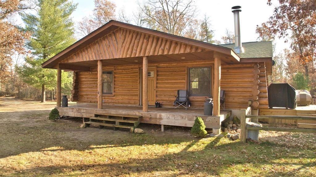 Are you looking for the most amazing log home that will literally take your breath away - where you could spend hours just marveling at all the handcrafted high end finishes of carved wood and stone? A home that is completely secluded - this home is calling for you.  Come check out the bath! Actually - the entire home is simply a work of art. There are  hand carved vanities, cabinetry & finishes throughout, the fireplace is truly stunning. There is great entertaining space outside, and 8 acres of mature trees.  The full basement is ready to be finished and has an egress window to add a 2nd bedroom if desired. Truly - this is absolutely stunning home located just outside of West Branch.