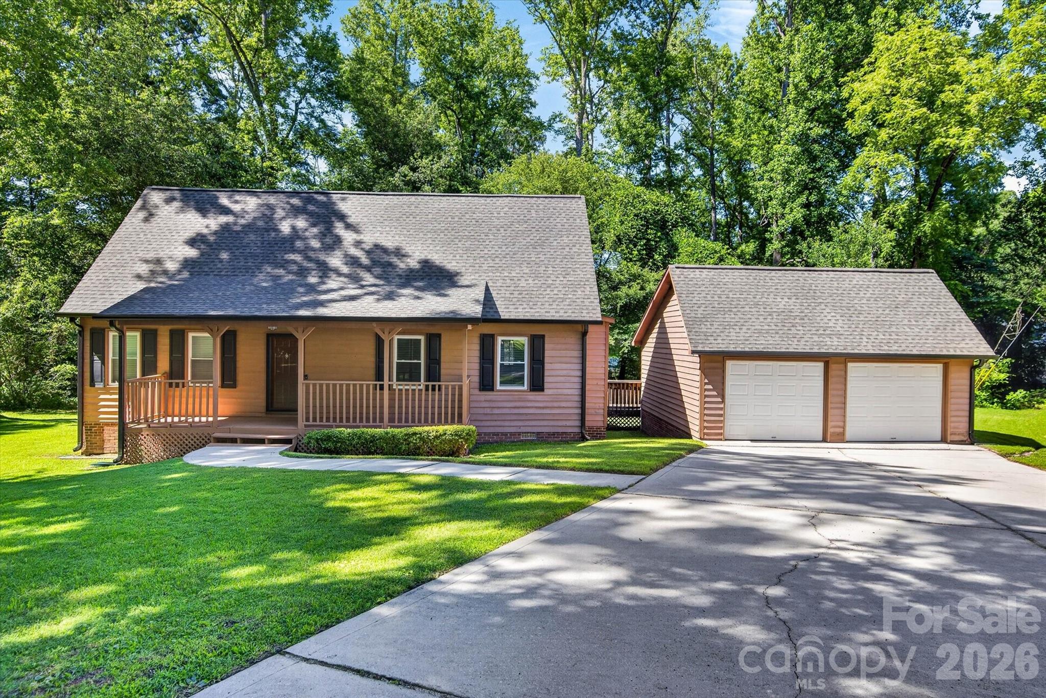 Privacy. Space. Location. This one checks all the boxes! Nestled at the end of a quiet cul-de-sac on nearly an acre with this charming property offers the freedom of country living with the convenience of being just minutes from shopping, dining, and everyday essentials. Enjoy your morning coffee on the welcoming front porch, tackle projects in the detached 2 car garage and wired workshop, or simply relax and unwind in the flat, private backyard. Recent updates, including a new roof in 2021 and HVAC and water heater replacements in late 2023, provide peace of mind for years to come. Sold as-is, with great bones, this home presents an incredible opportunity to make it your own.