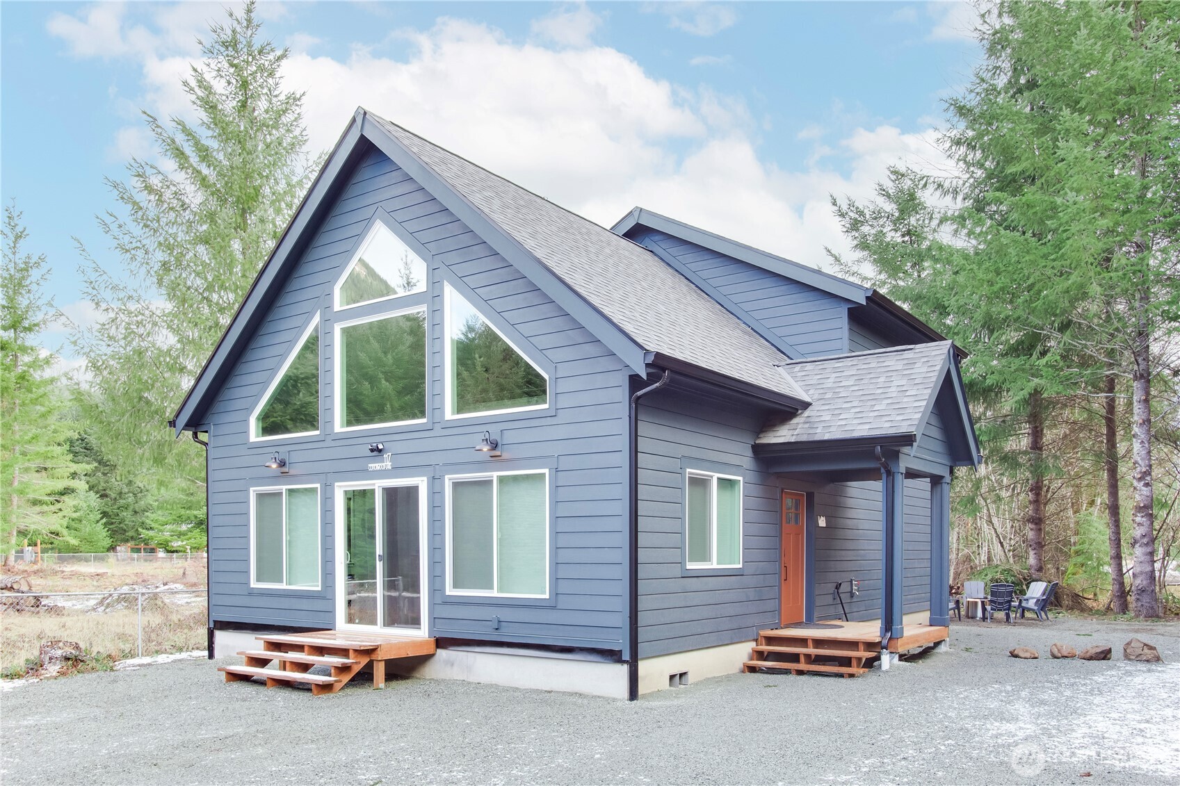 Beautifully finished and offered fully furnished, this 2022-built Packwood cabin is ready to enjoy from day one. The 3-bedroom, 2-bath home offers 1,620 square feet of comfortable mountain living, featuring an open-concept great room, well-appointed kitchen, flexible loft/game area, and plenty of space to gather with friends. A heat pump provides year-round comfort, while the private hot tub, firepit, and peaceful wooded surroundings create an inviting place to relax after a day exploring Mt. Rainier National Park, White Pass Ski Area, nearby trails, and the Cowlitz River. The sale includes an adjoining parcel totaling approximately 0.43 acre, offering additional privacy, outdoor space, and flexibility. Community river-park access adds to the recreational appeal. Whether used as a full-time residence, weekend escape, or mountain retreat, or a vacation rental to offset some expenses--This turnkey Packwood home offers modern construction, a welcoming layout, and an ideal location for enjoying everything the area has to offer.