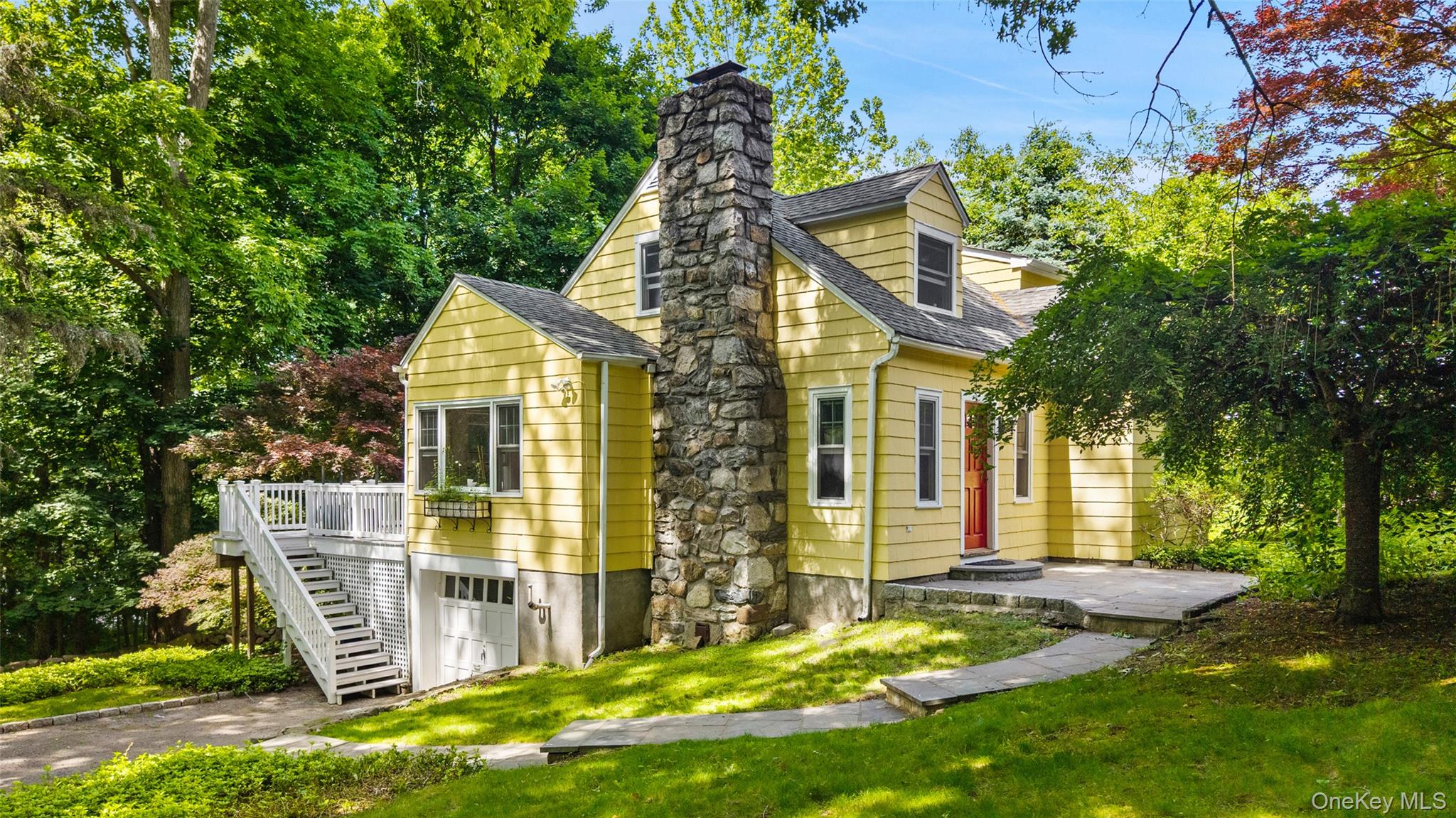 CHARMING 1930'S. The perfect country house. Wood-Shingle Cape in the Heart of Stanwood. Beautifully updated four-bedroom home-circa 1937. Sun-filled rooms with Fir floors. Living Room with stone fireplace. Dining Area opening to renovated Kitchen with granite countertops and stainless appliances. Four Bedrooms with Two full Baths. Spacious rear deck for summer barbecues and outdoor entertaining. Beautifully landscaped parcel bordering peaceful woodlands and the protected watershed lands of the New Croton Reservoir. Gorgeous seasonal water views. Marvelously convenient location.  Will not last!