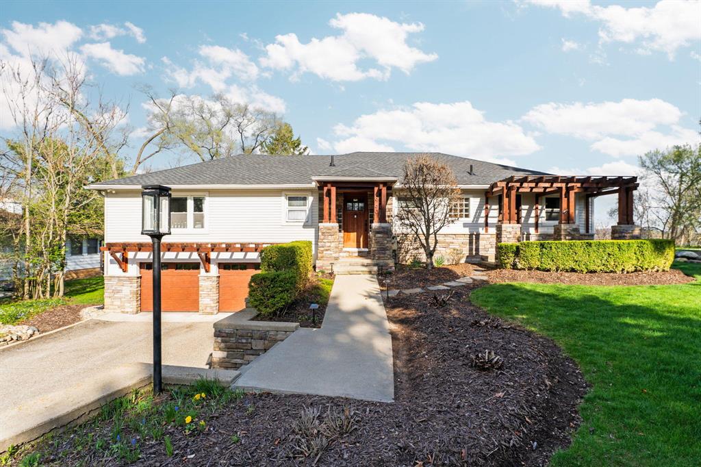 This may be the best view on Portage Lake! Perched on a scenic hillside, this beautiful 3-bedroom ranch offers breathtaking lake views, pool & sits on a picturesque acre of lush greenery. True lake living, the property features two boat slips and a brand-new dock--perfect for enjoying all your water activities. Beautiful wood flooring flows throughout, while expansive windows fill the home with natural light in every room. The spacious lower level offers incredible flexibility, ideal for a home office, exercise room or additional living area to fit your needs. Mornings on the dock taking in stunning sunrises, & unwind in the evenings from the screened-in porch or expansive pool deck overlooking the lake. After a day on the water, relax and recharge in your private sauna. This home also provides a front-row seat to spectacular 4th of July fireworks. A rare opportunity to own a premier lakefront property with unmatched views, space, and amenities--lake living at its finest and More!