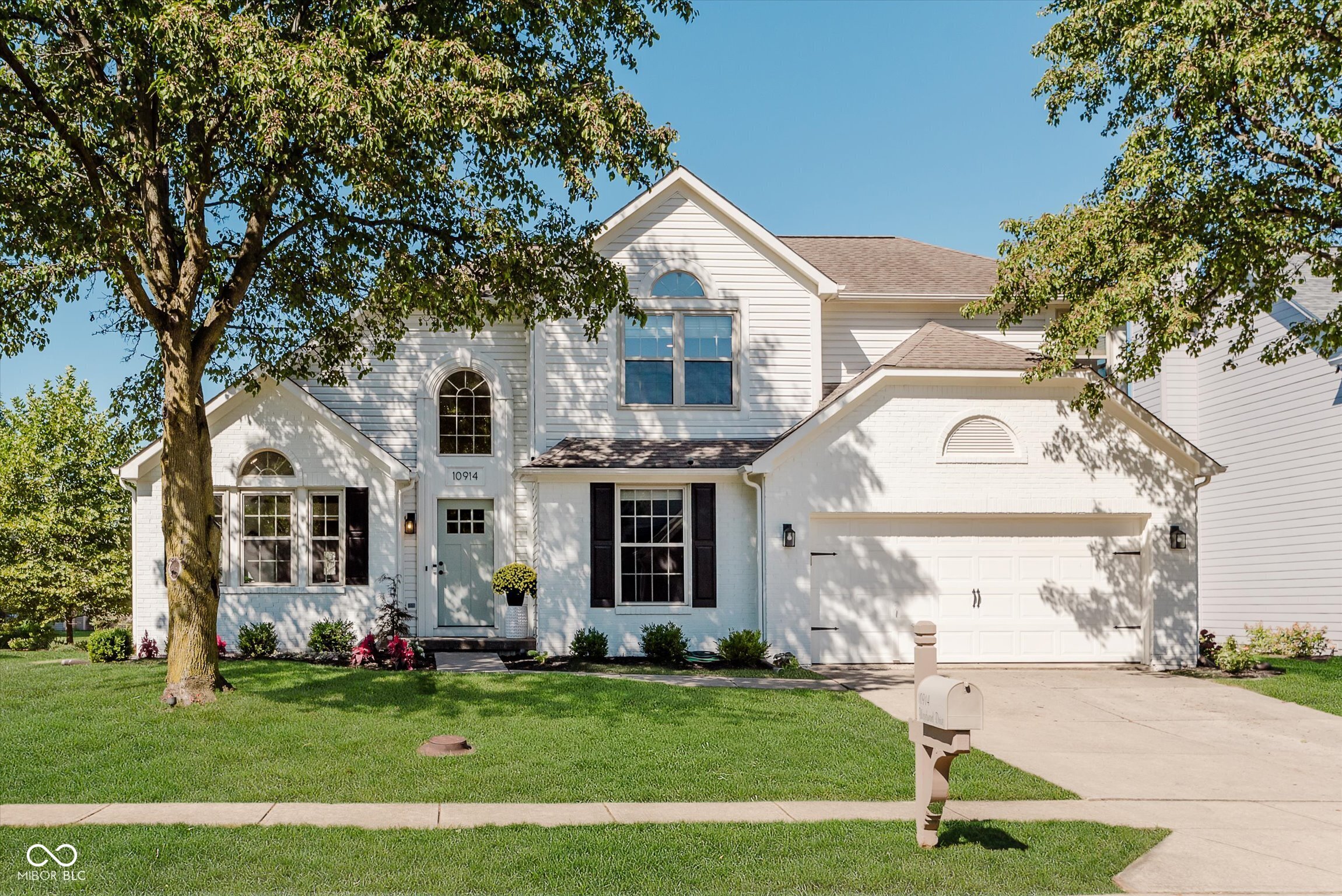Welcome to 10914 Woodward Dr, Fishers! Nestled in the desirable Sawgrass neighborhood near Ironwood Golf Club, this 3-bedroom, 2 full bath, 2 half bath home combines thoughtful updates with timeless charm.    Step inside to a bright, open floor plan featuring soaring 17-foot ceilings and abundant natural light. The spacious main-level primary suite boasts a cathedral ceiling, double-sink vanity, large walk-in closet, and a full bath with separate tub and shower. The updated kitchen shines with quartz countertops, stainless steel appliances, and a wine bar, opening seamlessly to the great room with a cozy wood-burning fireplace-perfect for entertaining or quiet nights in.    Upstairs, you'll find oversized bedrooms and a versatile loft space that can be converted into a 4th bedroom with an acceptable offer, or use it as a playroom, or flex space. The finished basement expands your living options with a large rec room, daylight windows, bonus room that could be a guest bedroom, and a convenient half bath.    Enjoy outdoor living in your private backyard oasis, complete with a spacious deck, pergola, 6-ft privacy fence, and exterior lighting-ideal for gatherings or peaceful evenings. Newer updates include new flooring, carpet, tile, and fresh finishes throughout.    Located just less than 5 minutes from the new Fishers Community Center and with easy access to all downtown Fishers has to offer this home truly has it all!