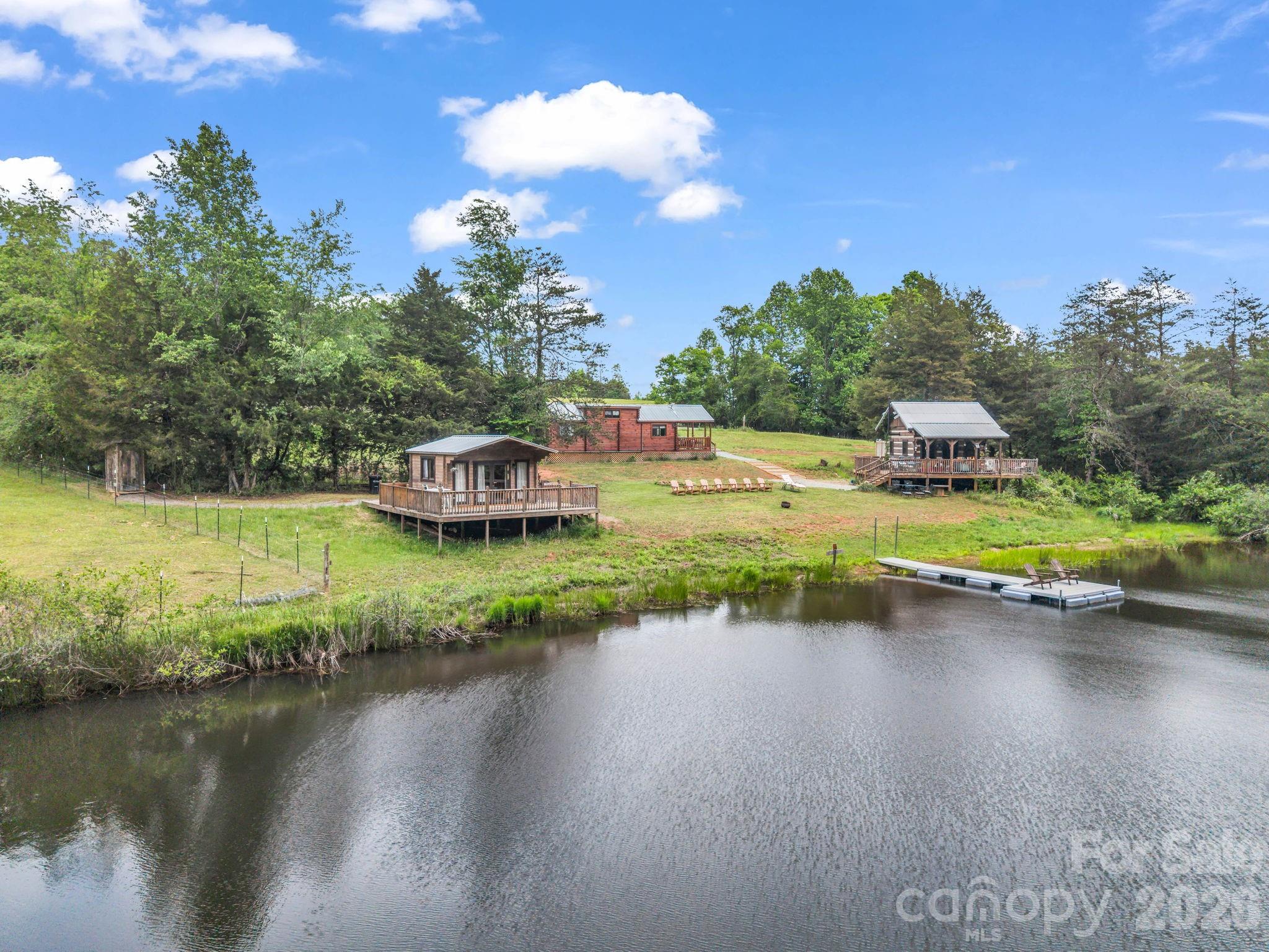 65+ Acre Multi-Structure Farmstead with Vintage Farmhouse, Wells, Pasture & private pond. Step into therhythm of country living with this expansive working farm offering a rare blend of usable land, existinginfrastructure, and timeless character. Anchored by a one-story farmhouse dating back to 1929, thisproperty invites you to restore, expand, or simply enjoy a lifestyle rooted in simplicity and space. Theland truly sets this property apart. Gently rolling terrain opens into wide, cleared pastures ideal forlivestock, equestrian use, or hay production. With a strong balance of open land and privacy, thisproperty is well-suited for a variety of uses—working farm, homestead, recreational retreat, or long-terminvestment. If you’ve been searching for acreage with character, infrastructure, and upside, this is aproperty that delivers on all fronts. Sold "As Is".