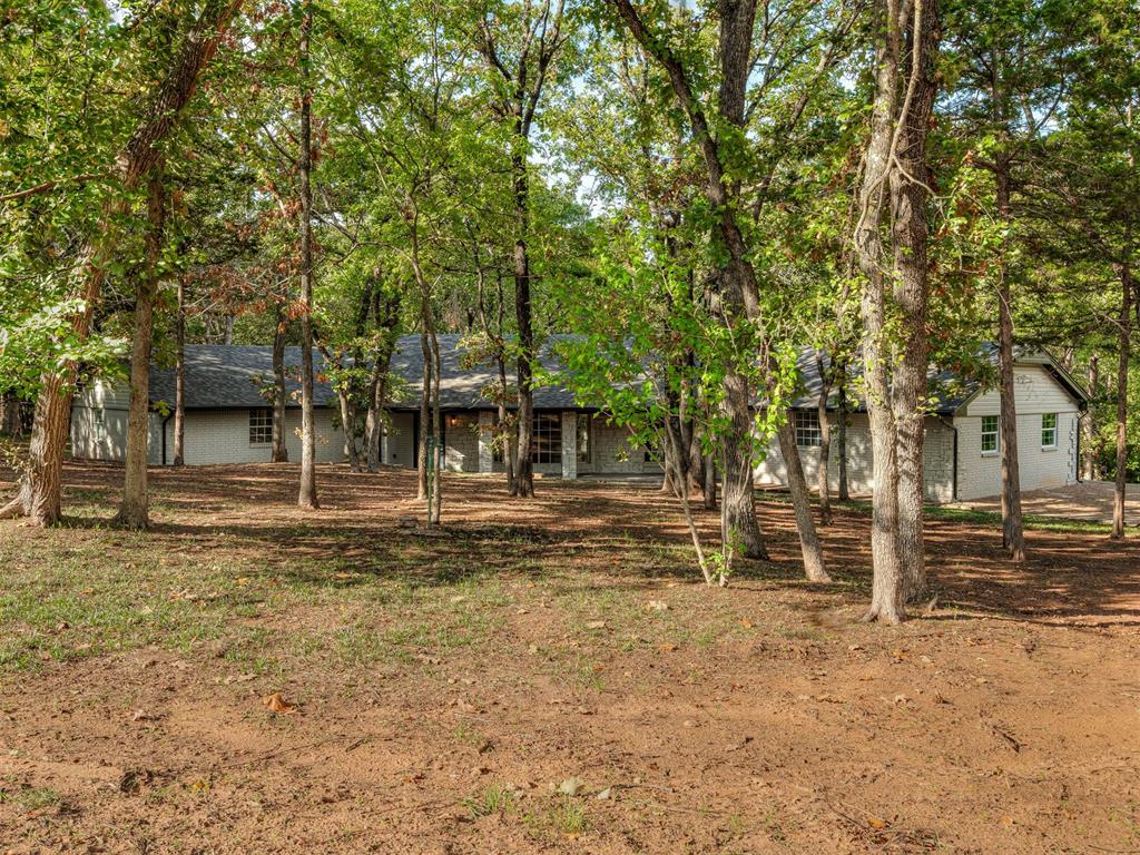 Set on 2+ beautiful acres in Norman, this fully renovated ranch-style home offers modern updates, natural surroundings, and plenty of room to roam. Featuring 4 bedrooms and 3 bathrooms, the home has been thoughtfully refreshed throughout with a remodeled kitchen and bathrooms, all-new cabinetry, flooring, appliances, lighting, doors, and trim, along with fresh interior and exterior paint and updated electrical. Major improvements include a new roof and gutters, serviced heating and air and water systems brought to code, select new windows and glass, and new cedar exterior beams. Outside, mature trees create a beautiful backdrop for the property, while the large covered patio offers an inviting space to relax or entertain. Recent landscaping, including tree removal and trimming, further enhances the grounds, and a basement shelter area provides added peace of mind. With extensive renovations already complete and 2.34 acres to enjoy, this property presents the rare opportunity for a move-in-ready home with room to spread out in Norman.