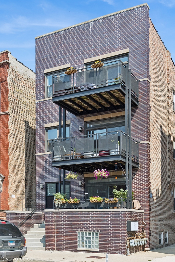 Discover the best of Ukrainian Village in this beautifully updated and ideally located home! Enjoy the charm of a classic, solid brick building enhanced with modern finishes and thoughtful upgrades throughout.  Step inside to a warm and inviting living area featuring an exposed brick wall, rich hardwood floors, and southern light pouring in from your private front balcony. The kitchen is perfect for entertaining, boasting stainless steel appliances, 42" custom cabinetry, granite countertops, and a spacious breakfast bar. The primary bedroom offers a restful retreat and the second bedroom is ideal for guests or a comfortable home office.  Host summer get-togethers on your private rear balcony and enjoy the convenience of in-unit laundry. Located in the heart of Ukrainian Village, you're just steps from vibrant shops, acclaimed restaurants, lively nightlife, and convenient public transit. This is city living at its finest!