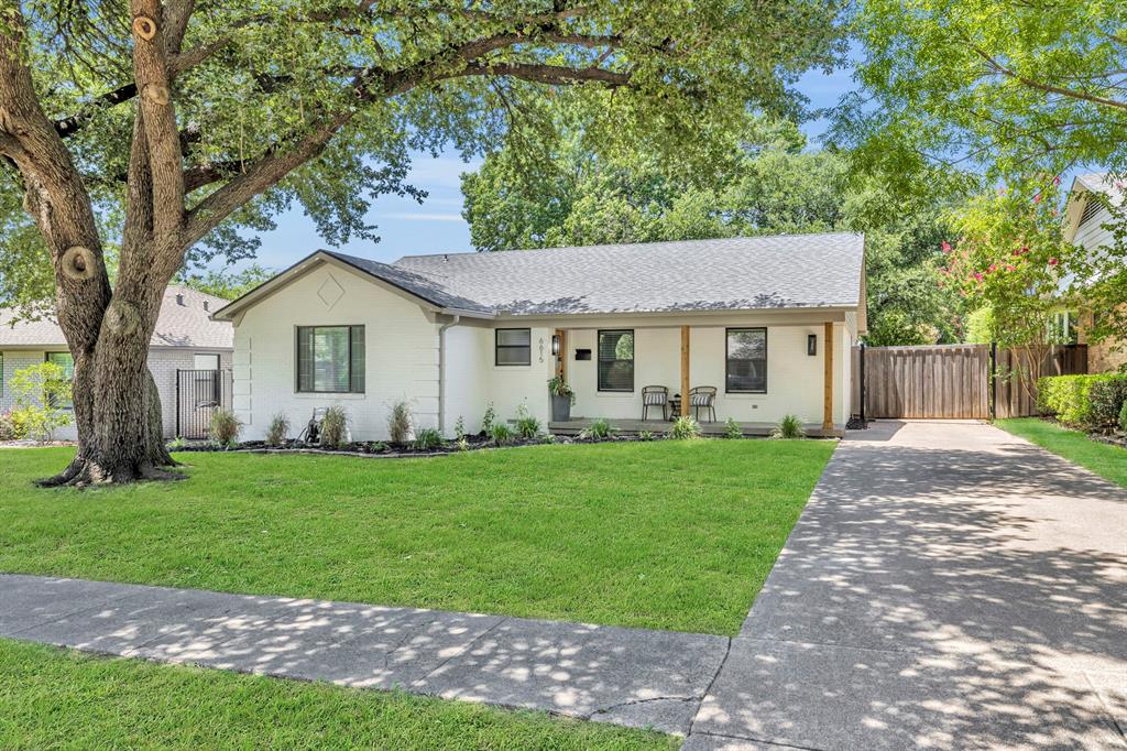 Flawlessly renovated single-story showstopper in the Heart of Dallas! Every inch of this stunning residence has been thoughtfully updated and impeccably designed—truly move-in ready with sophisticated style and modern comfort. From the moment you arrive, the curb appeal captivates. A spacious, elongated front porch sets the tone, perfect for morning coffee or evening wine while enjoying the canopy of mature trees in this highly sought-after, established neighborhood. Step inside and prepare to be wowed. The expansive living room features rich hardwood floors, beamed ceilings, and a seamless flow that’s ideal for both upscale entertaining and everyday living. French doors enclose a chic home office, offering privacy. The formal dining room makes a statement with its built-in wet bar, perfect for hosting in style. The kitchen is a true designer masterpiece—centered around a large island with seating, and finished with custom-painted cabinetry, a farmhouse sink, sleek tiled backsplash, checkerboard tile floors, and top-of-the-line gas cooking with a stylish vent hood. A charming breakfast nook opens to a cozy additional sitting area, creating the perfect casual living space. The primary suite is a tranquil retreat, generously sized and complete with a luxurious en-suite bath featuring dual vanities, designer fixtures, and a spa-worthy glass-enclosed shower. Three additional bedrooms are all beautifully appointed, and the two updated guest bathrooms feel fresh from a magazine spread. Step outside to a backyard made for enjoyment, with a spacious open patio and a lush grassy area perfect for pets, play, or relaxation. An automatic gate opens to a massive side patio—ideal for basketball, entertaining, or extra parking—and leads to a detached 2-car garage. This home is the perfect balance of timeless elegance and modern design, located in one of Dallas’s most desirable neighborhoods. Located near Ridgewood Park, trails, White Rock Lake, popular shopping and dining options.