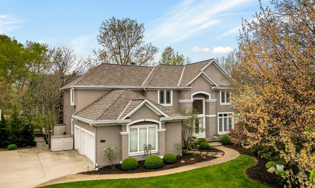 Exceptional custom home in the coveted Cedar Creek neighborhood. Situated amongst the private Shadow Lake and Shadow Glen Golf Course, beautifully landscaped and located on a 1/2 acre, corner, cul-de-sac lot, in true nature settings with mature trees. Numerous updates throughout, including the addition of an expansive screened in deck, built-in storage, exercise room, some new windows, and a newly repaired roof! This dramatic 2 Story entry with curved staircase opens up to a 5000+/- sq ft floor plan with floor to ceiling windows, wonderful for living & entertaining. The gourmet kitchen has all high-end SS appliances and newly resurfaced cabinetry. The screened in porch opens to a large paver patio w/ fire pit, for the ultimate outdoor entertainment area. The huge primary suite is a true sanctuary, with spa like bath, his and her walk-in closets and a spacious sitting room. LL offers great entertainment space with family room, rec area and wet bar, and the exercise room features a full wall wall and KC skyline mural! LL Also features ample built-in storage spaces, and the 5th bedroom is currently a craft room. LL walks out to paver patio area. So much to enjoy in this quality built home! Don't miss it!