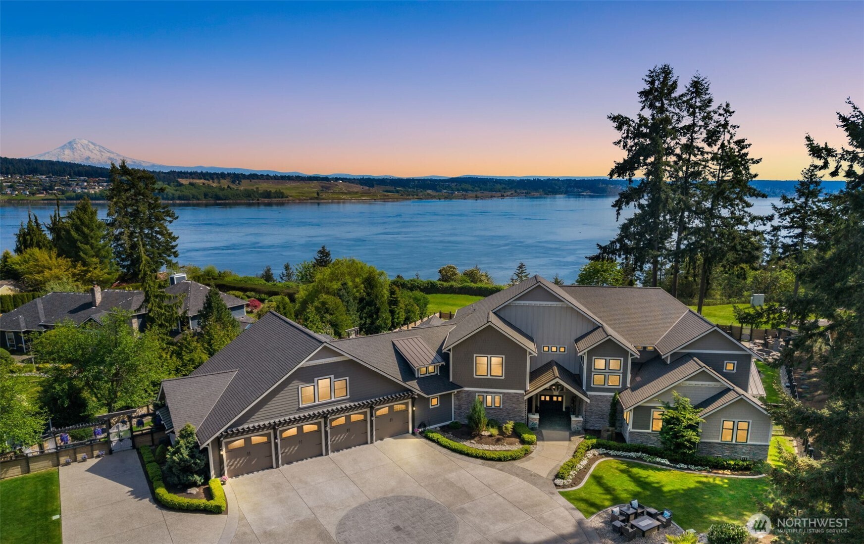 Experience Fox Island’s ultimate luxury escape—an extraordinary 2021 estate blending modern elegance w/ stunning design. Nearly 7,000 sq ft on 1.29 private acres w/ panoramic views of Mt. Rainier & Puget Sound. 7 beds, 5 baths, 3 kitchens, Seahawks-themed media room, pool, 2 hot tubs, putting green, RV parking & income-producing Airbnb suite. Resort-style grounds feature waterfall, fountain, pond, firepits, swing, outdoor kitchen, gas FP & TV. Thoughtfully curated finishes make this turnkey property a true Pacific NW masterpiece.