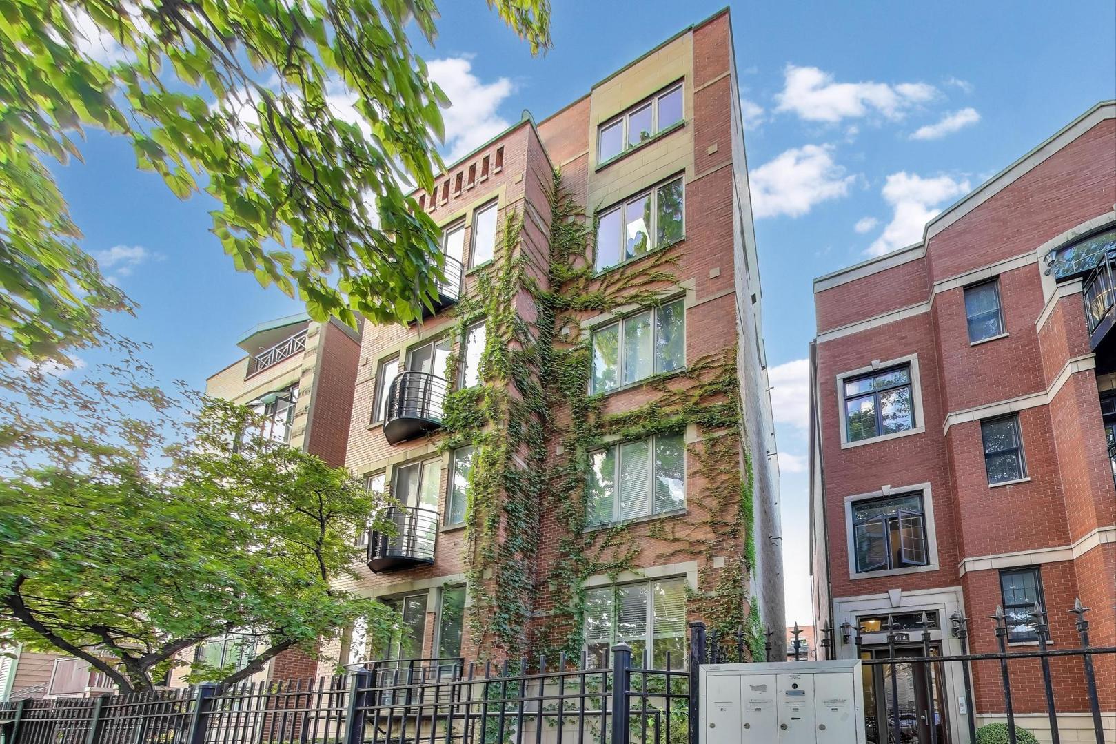 Step into this spacious and light-filled duplex-down that truly has it all! Set in an extra-wide building on a tree-lined street at the crossroads of Logan Square and Bucktown, you're just steps from the 606 and the Blue Line.    From the moment you enter, you'll be drawn to the open, airy layout, perfect for entertaining. Oversized south-facing windows flood the dining, kitchen, and living spaces with natural light, creating a warm and inviting atmosphere.    The updated kitchen is designed for both style and function, featuring stainless steel appliances, granite counters, and abundant cabinet space. On the main level, you'll find two bedrooms (each with its own en-suite bath) plus a convenient powder room. The primary suite is a private retreat, offering two walk-in closets, a spacious bath with soaking tub and separate shower, and doors leading to a private balcony. The second bedroom across the hall also includes a full bath and generous closet space.    The lower level is where this home truly stands out. With high ceilings and an additional living area, it's perfect for hosting guests, creating a private suite, or simply spreading out. The soundproofed bedroom makes the ultimate recording studio, podcast space, or quiet home office. A cozy den provides even more flexible work-from-home or lounge space. This level also includes a full bath, a large storage closet, and walk-out access to a private patio.    Out back, enjoy your own fenced yard and the rare luxury of covered parking for two cars (tandem).    Location couldn't be better, you're in the heart of it all, with easy access to the Blue Line, the 606, and a vibrant mix of cafes, restaurants, and shops just a short stroll away.