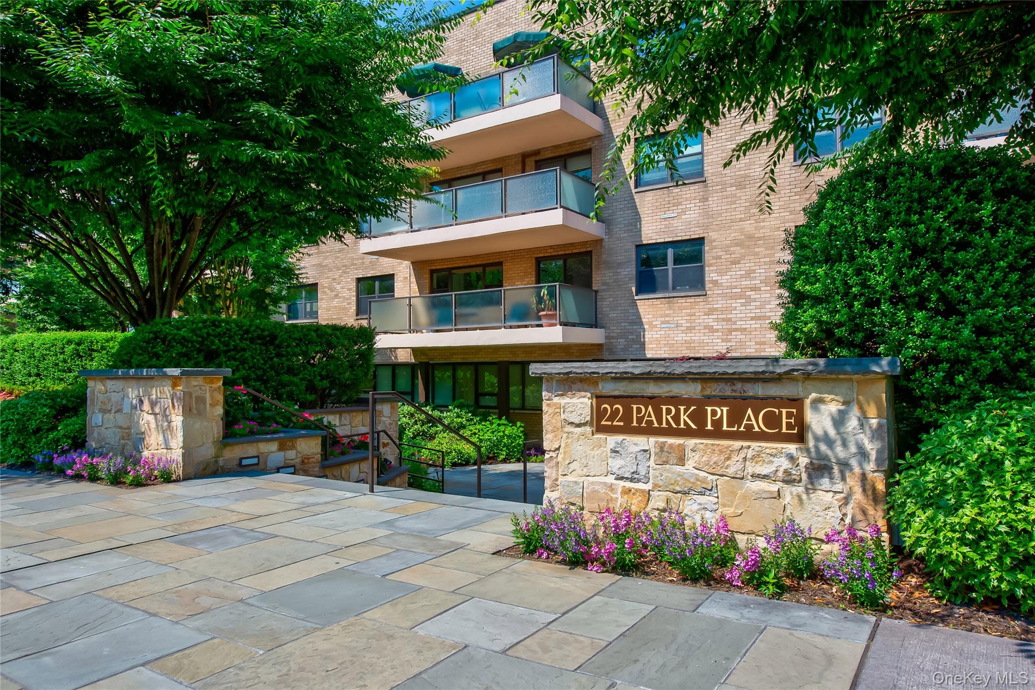 The Coveted Junard House ~ Rare TOP FLOOR offering  in one of Great Neck's premiere full service buildings with an excellent staff. Featuring a part time doorman, gym, roof deck, storage bin, heated garage, complimentary laundry machines on each floor, live in managing super & video surveillance.  Centrally located in the heart of vibrant Great Neck Plaza, in close proximity to restaurants, shopping, libraries, LIRR train lines to Penn Station & Grand Central Madison, buses to Flushing & medical facilities. This sun filled top floor apartment features a private terrace showcasing a garden view, hardwood floors, individually controlled thermostats with PTAK heat & air units, recessed lighting, terrace, renovated kitchen and baths, & several walk in closets. Maintenance includes taxes, heat, water, & gas. Designated for Baker Hill Elementary School, Optional Zone for Great Neck South Middle & High School with membership to The Parkwood Pool District & Steppingstone Park with Marina.