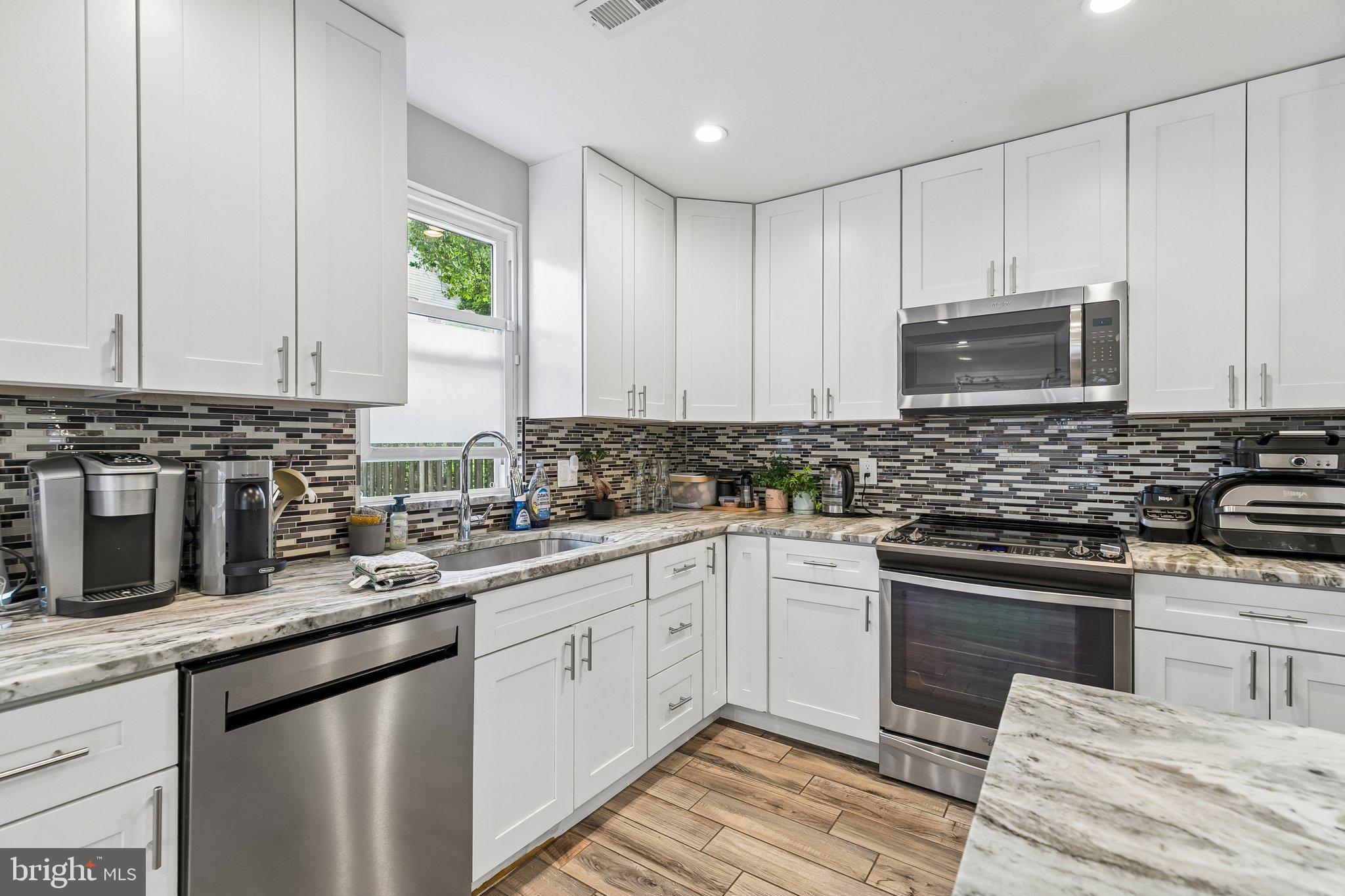 Welcome to 30 Bryn Mawr Ave, a beautifully updated 3-bedroom, 2.5-bath home in the heart of Bala Cynwyd, offering modern finishes, spacious living areas, and a thoughtfully designed open layout. Blending comfort and functionality, this home is ideal for both everyday living and entertaining.The main level features a bright and inviting living room with recessed lighting and oversized windows that fill the space with natural light. The renovated kitchen showcases white shaker cabinetry, stainless steel appliances, granite countertops, tile backsplash, a center island with seating, pendant lighting, and a dedicated dining area. Also located on the first floor is an additional room that can easily function as a home office, playroom, guest space, or potential 4th bedroom by simply adding a closet.Additional highlights include updated flooring throughout, renovated bathrooms, a convenient first-floor powder room, second-floor laundry, and generously sized bedrooms with excellent natural light. The primary suite offers a beautifully updated full bathroom and a comfortable retreat at the end of the day.Outside, enjoy a large fenced yard, mature landscaping, and a rear deck perfect for entertaining, outdoor dining, or relaxing.Ideally located just minutes from Suburban Square, Narberth, and downtown Bala Cynwyd, this home offers convenient access to local dining, shopping, parks, the Cynwyd Heritage Trail, SEPTA Regional Rail, City Avenue, I-76, Route 1, and Center City Philadelphia.