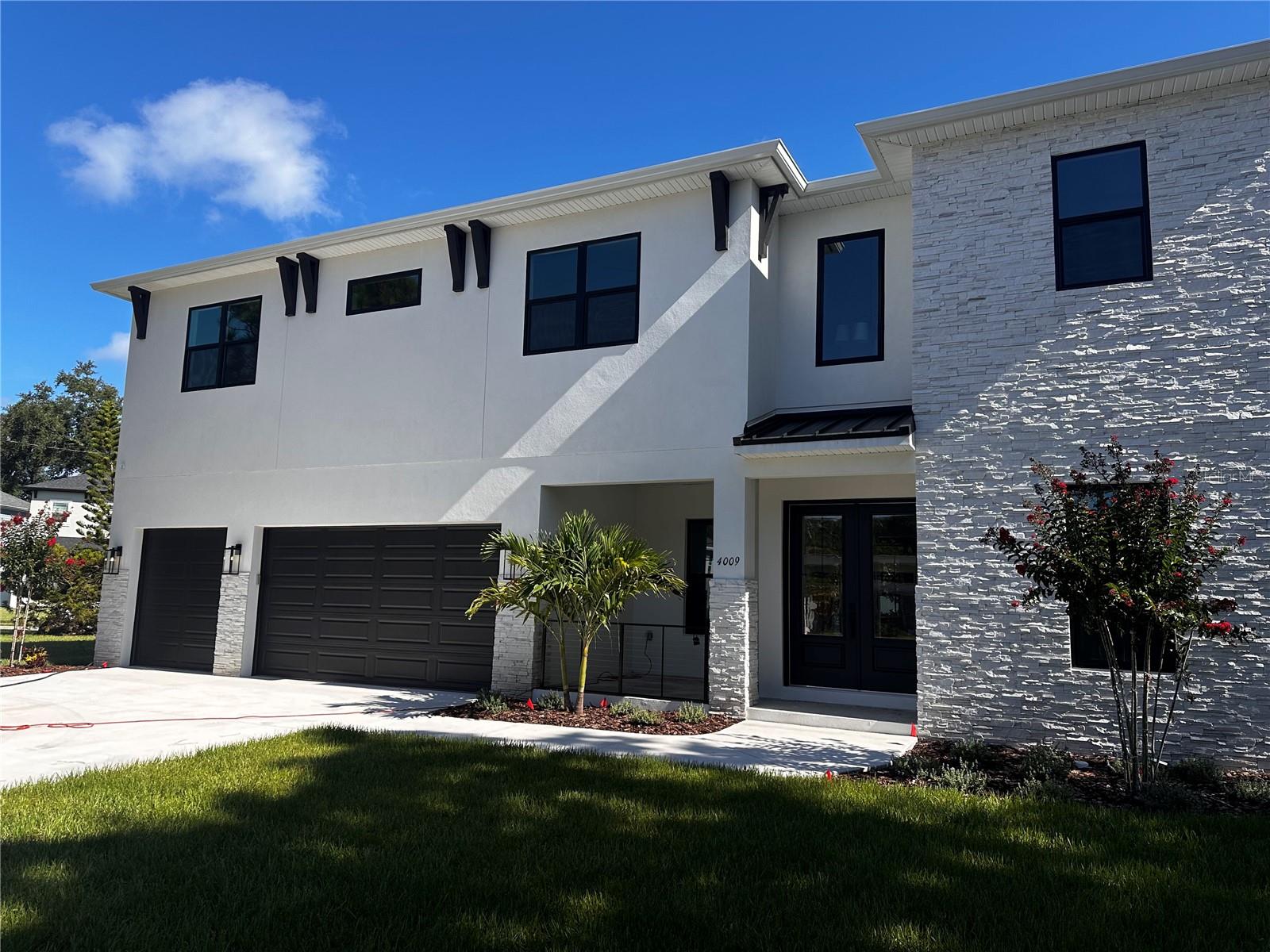Photos and Virtual Tour are of an artistic rendering of the home for comparison purposes only and may show options/features no longer available. Nearly Complete! Completing the finishing touches now! Introducing 4009 Euclid, a breathtaking residence in the heart of South Tampa that effortlessly combines luxury, comfort, and modern style. Crafted by the esteemed Chadwell Homes, known for their exceptional quality, this nearly completed home spans an impressive 4,094 square feet. Featuring five spacious bedrooms and four full bathrooms, it’s designed with meticulous attention to detail and high-end finishes throughout.
As you step inside, you’ll be greeted by a grand foyer with high ceilings, and office, and downstairs bedroom. The gourmet kitchen is a chef’s dream, boasting top-of-the-line appliances, including a 36-inch gas cooktop, wall oven, and a custom hood. A walk-in butler’s pantry, mudroom, and laundry room enhance convenience and provide ample storage solutions.
The master suite is a private retreat, complete with a spa-like bathroom featuring custom cabinetry, dual sinks, separate shower, soaking tub, and a generously sized walk-in closet. Additional bedrooms are thoughtfully designed with walk-in closets and stylish designer touches, ensuring every family member or guest enjoys comfort and sophistication. A bonus room and study offer flexible spaces for work, relaxation, or play, while the three-car garage adds practicality.
Step outside to your spacious lanai overlooking the backyard complemented by a pool bath—perfect for enjoying Florida’s sunshine. Built with durability and sustainability in mind, this home includes hurricane strapping, impact-resistant windows, and an engineered truss system. The lush landscaping is maintained by a multi-zone irrigation system, and the exterior impresses with sand-textured stucco, a modern garage door, and double entry door.
Zoned for the highly sought-after Plant, Coleman, and Mabry school district.
Located in the desirable Bel-Mar neighborhood, this home offers convenient access to Downtown Tampa, Hyde Park, Tampa International Airport, International Plaza, and more. Don’t miss the opportunity to own this extraordinary home. Contact us today for a private showing!