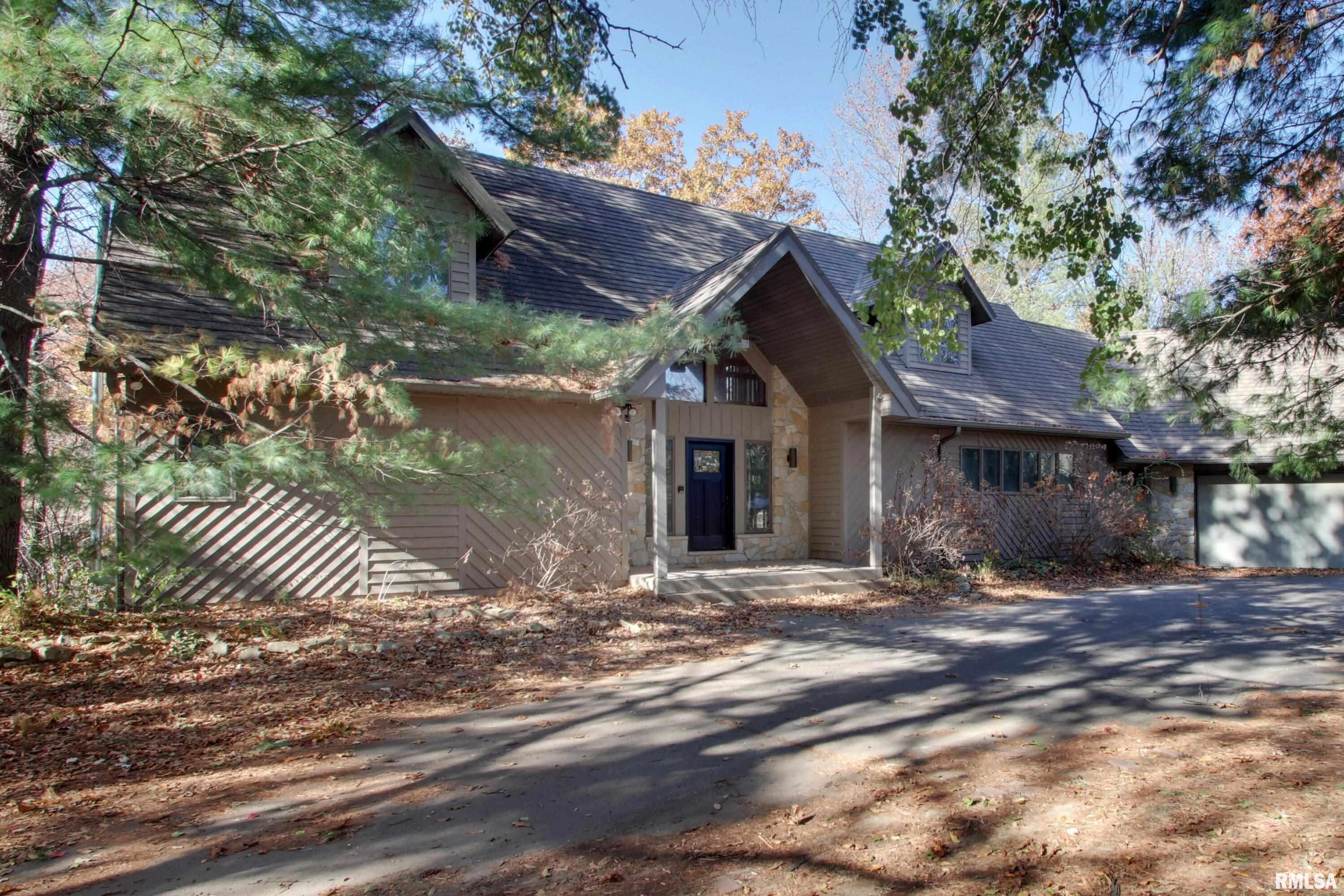 Wow what a property that can be your dream home with some renovation. This home is priced based on  the items that it needs to be spectacular. Therefore it is being sold in "as is" condition. It will make someone a wonderful home. Full walkout finished basement with wet bar. There is a floored area above garage with direct access from the second floor that could add up to 800 Square feet to the home. Really nice wooded lot with access to a pond. Be sure to see this home and see what you can do to make it yours.