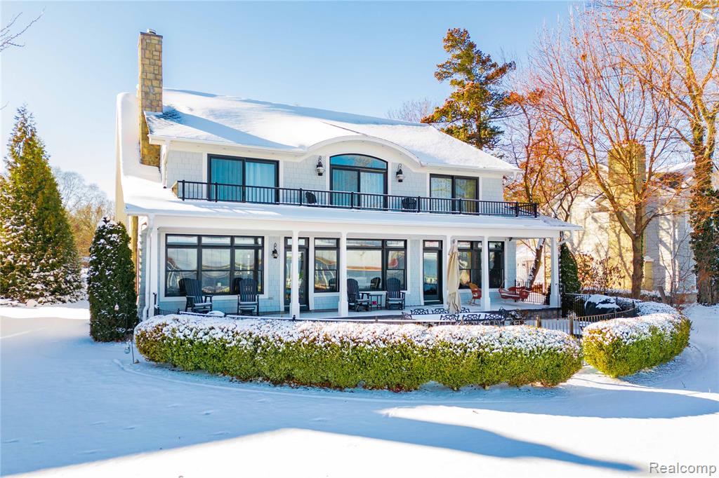 An unbelievable waterfront offering on Lighthouse Pointe, this impeccably maintained estate spans 6,273 square feet and captures some of the most breathtaking international waterway views available.The main residence features three bedrooms, two full baths, and two half baths, with gracious living and dining rooms, a well-appointed kitchen, and a charming eating nook that doubles as a sitting area—perfectly positioned to take in the spectacular waterfront scenery.A private apartment above the heated 3-car garage offers exceptional flexibility, complete with one bedroom, kitchen, family room, laundry facilities, and private entrances from both the garage and the main house—ideal for guests or extended family.The beautifully finished lower level includes a fourth bedroom, full bath, and an expansive recreation room. A finished detached garage with bathroom adds even more versatility.Outdoor amenities are equally impressive, featuring a newer galvanized dock, seawall, and boat lift that is 16' x 60' 40-ton capacity with a 6'per minute lift all set against the backdrop of the iconic Lighthouse and unsurpassed views of passing freighters.Additional highlights include a whole-house generator, central vacuum, 3 stop elevator and integrated stereo system in the living room and waterside porch.All in impeccable condition—this is a rare opportunity to own an extraordinary waterfront home in a truly exceptional setting.