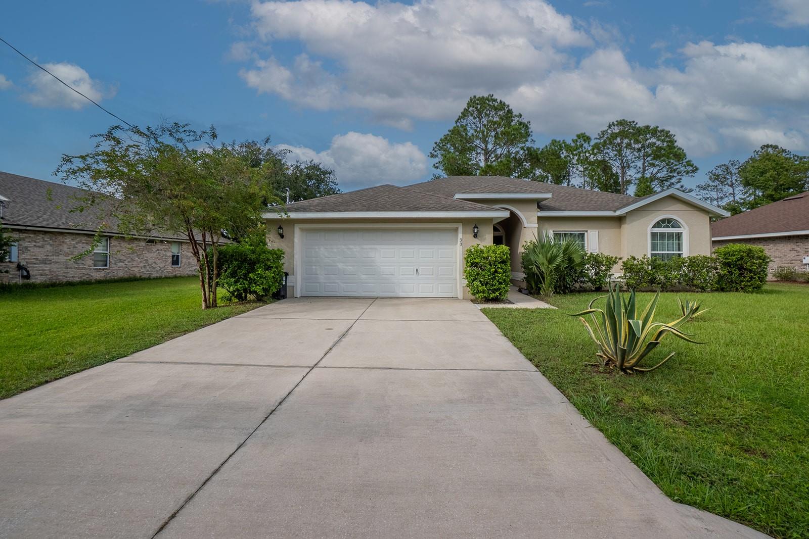 Tucked away in the heart of Palm Coast in Lehigh Woods, this wonderful, centrally located concrete-block Seagate home is a must-see. This delightful 10-year-old Seagate Captiva II model was lightly used as a seasonal second home by one individual. With tile flooring, granite countertops, a covered back porch, and an open floor plan, this home is move-in ready.  The home features stainless steel appliances, tile flooring, a breakfast nook, a laundry room, a 2-car garage, and an open layout that flows into the living area.  Situated in central Palm Coast, the beaches are just minutes away, and nearby Daytona Beach and St. Augustine are just 30 minutes away.