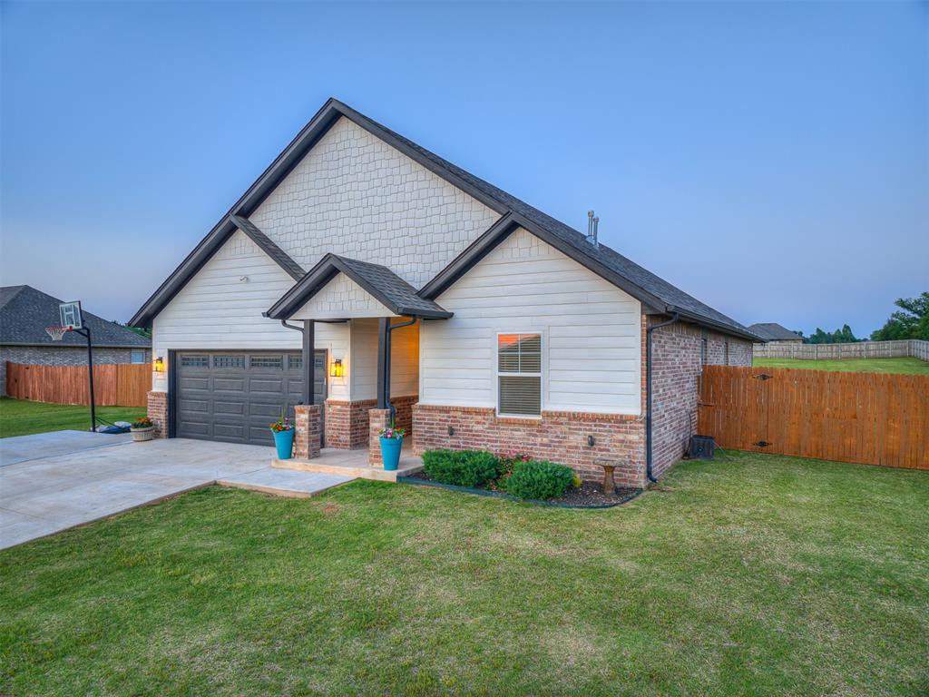 It's the one you've been waiting for! Welcome to this absolutely stunning better-than-new home with tons of upgrades in Deer Creek Schools! This spacious true 5-bedroom home sits on a huge lot approved for a shop! Step inside and you'll be greeted by the warmth of beautiful natural wood-look tile that spans the entire first floor creating a cozy and inviting atmosphere. The heart of the home is the main living area featuring a cozy hearth that opens to the chef's kitchen creating the perfect flow for entertaining. The kitchen has so many amenities including a large center island, huge corner pantry, stunning granite countertops, and even a glass rinser! All bedrooms are located downstairs with a convenient split floor plan. Upstairs is a massive bonus room and half bath - the possibilities for this space are endless! The sellers have spared no effort enhancing this property with upgraded lighting illuminating each space, ceiling fans installed in every room, and exterior concrete extending around the side of the house and the driveway. Located in a peaceful charming neighborhood, this well maintained home offers the perfect balance of serene country living with a convenient location. Don't miss it! Schedule your showing today!