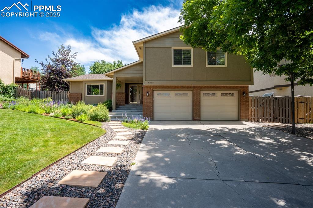 Welcome home! This beautifully updated home offers 3,396 finished sq ft  living space on a .2-acre lot in a great central location within a quiet neighborhood. With 4 bedrooms on the same level and 2.5 baths, including a luxurious 5-piece primary bath with attached walk-in closet and a private slider to the backyard, this home is perfect for modern living. Enjoy 3 spacious living areas, a wood-burning fireplace, wet bar and a recently remodeled kitchen featuring stainless steel appliances and new quartz countertops and tile backsplash. Step outside to a stunning backyard with a perennial garden, composite deck, and smart sprinkler system. Recent upgrades include a new roof with class 4 impact-resistant shingles, newer HVAC, water heater, and exterior paint/stucco. Convenient 2-car garage and plenty of storage make this home a true gem!