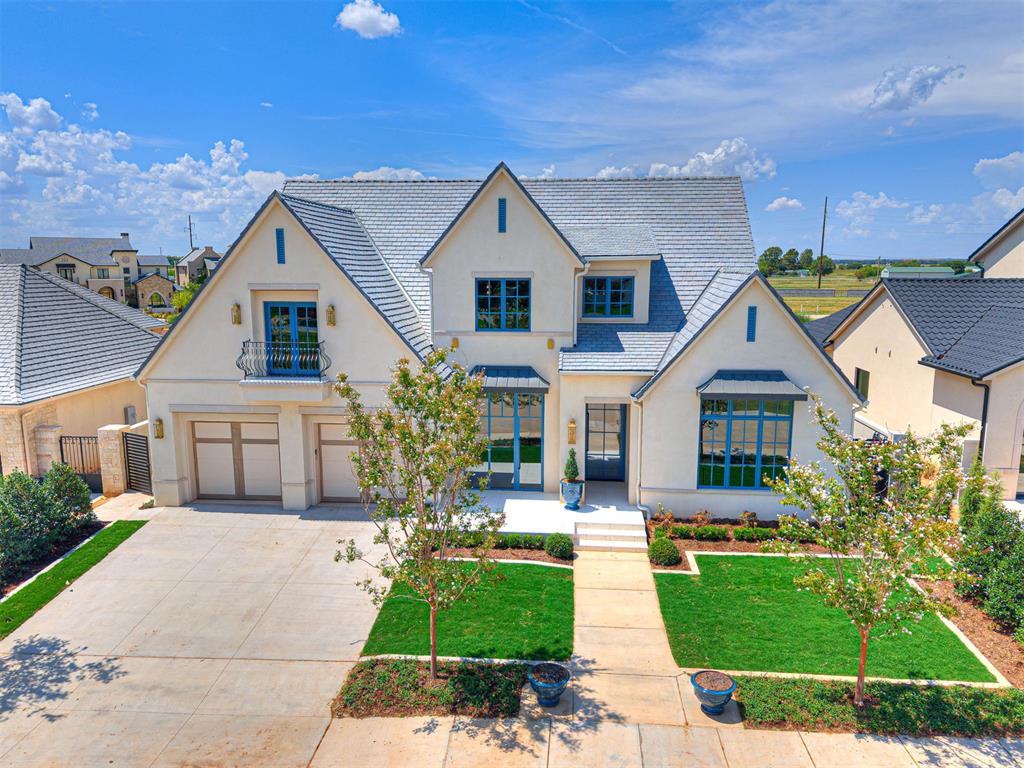 This stunning home offers a perfect blend of luxury and versatility tailored to fit your lifestyle. Nestled in the serene lakefront setting of the Villas at Ashton Grove - Norman's premier luxury home community - this residence welcomes you with an inviting foyer and elegant wood floors that flow seamlessly throughout. The expansive layout features a beautifully appointed dining area, ensuring every inch of space is utilized to its fullest potential. An adaptable office/study/second living area allows for customization to meet your specific needs. The living room, complete with a cozy fireplace, opens directly into a modern gourmet kitchen, creating an ideal space for gatherings and relaxation. Enjoy easy access to the patio for seamless indoor-outdoor living with automatic screens. A standout feature is the two lower-level luxury suites, each with convenient utility room access. An additional suite upstairs provides privacy, while a flexible room showcases stunning lake views, perfect for a workout room or study. Equipped with top-of-the-line appliances and fixtures, this thoughtfully designed residence combines comfort with modern elegance. The community itself enhances your lifestyle, offering picturesque lakes, serene walking paths, and secure entries for your peace of mind. Experience luxury living at its finest in this remarkable home.