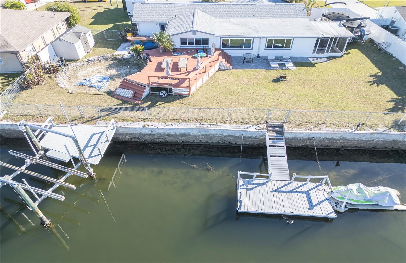 Calling all investors and smart buyers . Have you been looking for the perfect water front property, then check this one out. This 4 bedroom 3 bath home on a double lot with seawall lift and floating dock, It is located on the widest and deepest canals in Hudson with direct gulf access. with a 109 feet of seawall easy to dock your yacht It does need remediation from hurricane Idalia. The roof was done in 2019, and in excellent shape. This one will make a great fix and flip a VRBO or a great long term home. Come check out the great Golf cart friendly community  of Hudson One of the last places in Florida to own reasonable price water front Home. Call now to your private showing, Very Motivated seller, Bring all offers