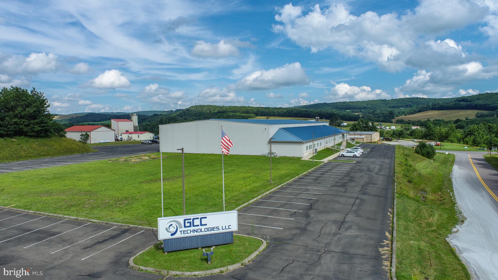 Secured 30,000 sq ft compound zoned commercial, just off State Route 135. Currently configured with 13 offices, 3 conference rooms, 2 open bullpens, a formal lobby and much more. Full kitchen and dual restrooms support all-day operations. Rear flex bay runs 100 x 120 with twin full-height doors, ideal for storage, shipping, or clean tech. Climate-controlled server space and a whole-site generator in place. Paved lot, easy access, plenty of parking. Call today for details!