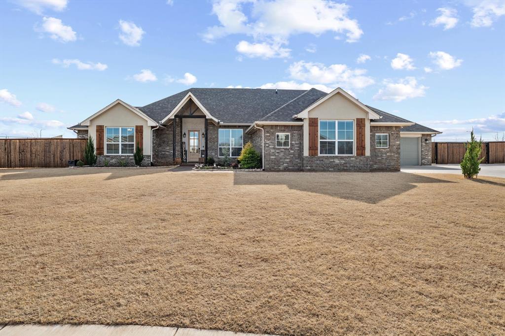 Step into this like-new, modern 4 bedroom, 2.5 bath home tucked away on a quiet cul-de-sac and sitting on a generous .65-acre lot. Designed with today’s lifestyle in mind, the home features a bright open floor plan, raised ceilings, and wood-look ceramic flooring throughout the main living areas. The heart of the home is the stunning kitchen, complete with a large center island, 3 cm granite countertops, abundant cabinetry, and exceptional storage—perfect for entertaining or everyday living. The spacious primary suite and secondary bedrooms are thoughtfully laid out, while the bathrooms showcase Italian marble vanities for a refined, upscale feel. An oversized 3-car garage, expanded front porch, and extended driveway provide both functionality and impressive curb appeal. Out back, enjoy evenings gathered around the backyard fire pit, with plenty of room to relax or customize your outdoor oasis. Located in the highly regarded Mustang School District, this home also offers easy access to the airport and downtown, making commuting a breeze. Ask for the extensive list of upgrades and improvements completed since purchase just two years ago. A rare combination of space, style, and location, this exceptional property is truly move-in ready and not to be missed.