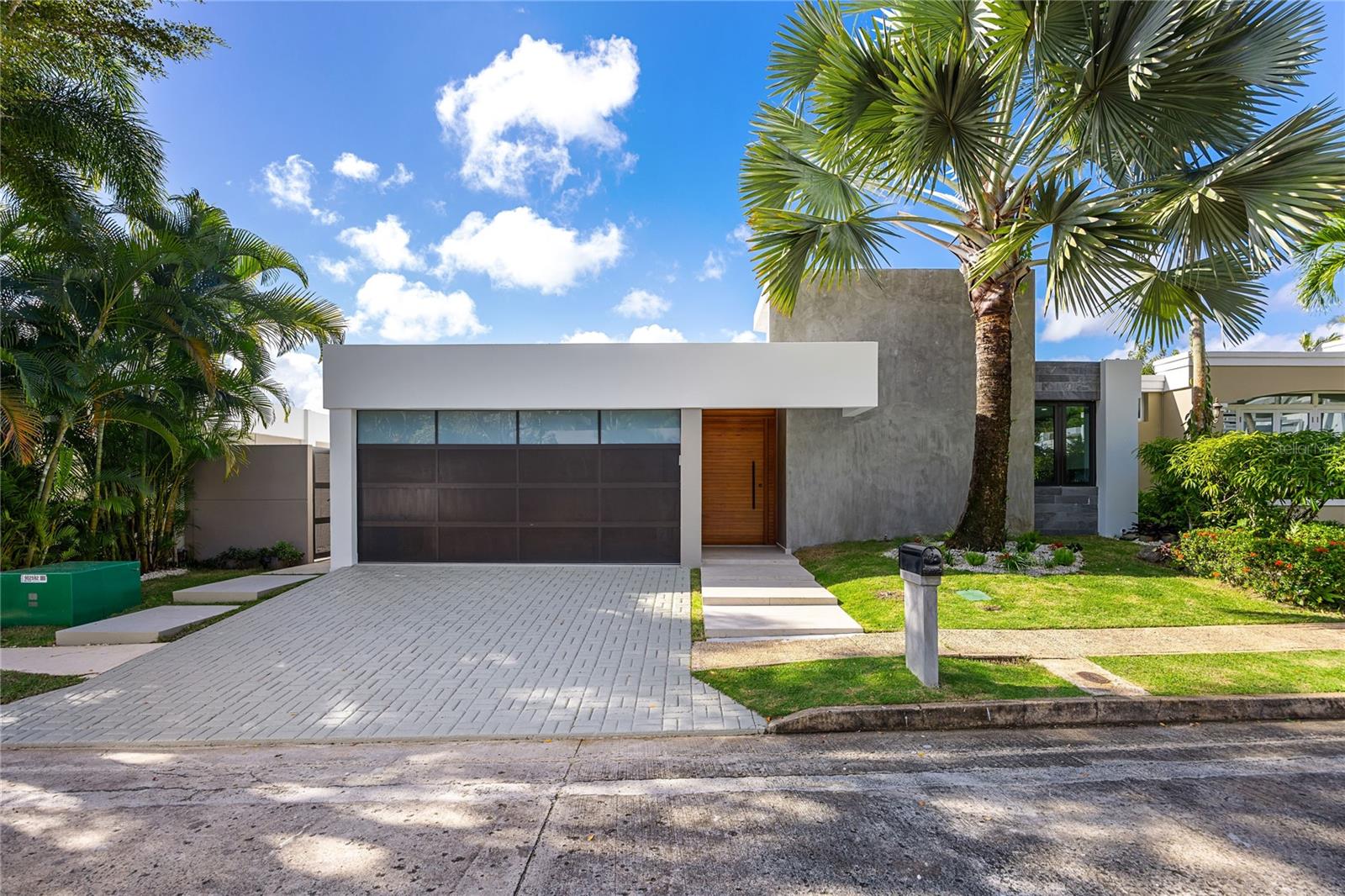 This captivating architectural masterpiece is located in La Villa de Torrimar. The contemporary Model 5 fully remodeled design home sits on a 561 square meter lot and features 2,650 sq ft. The impressive outdoor boasts a stunning covered terrace, and gorgeous pool. Ideal home for entertaining family and friends. Modern and elegant, with unique personality and exquisite finishes. This turnkey property features a spacious living room, dining room, family room, a gourmet kitchen and a powder room. Fully equipped kitchen with top of the line appliances. Four bedrooms, and three bathrooms. A luxurious master suite with a private "en-suite” resort style bathroom and two closets. One junior suite with ensuite bathroom. Two bedrooms and a bathroom and a convenient laundry area. La Villa de Torrimar is a unique community where residents can enjoy a variety of facilities including basketball court, tennis courts, gazebo, club house, and playground. Additionally, the neighborhood has 24-hour security. Call us today to coordinate a private showing.