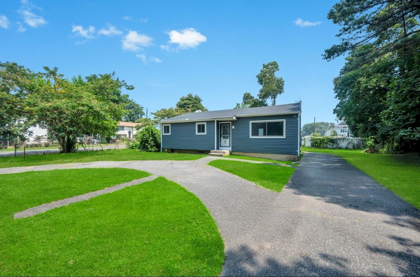 Welcome to 79 S 28th Street, Wyandanch, NY — a beautifully renovated ranch-style home situated on a desirable corner lot. This turnkey property offers 3 spacious bedrooms and 2 full bathrooms, blending modern design with comfortable living. Enjoy peace of mind with brand-new plumbing, electrical systems, roofing, siding, windows, and flooring throughout. The open-concept layout features a stunning kitchen with quartz countertops, stainless steel appliances, and ample cabinetry.
The fully finished basement includes a full bathroom, laundry area, and an additional room perfect for guests, extended family, or a home office. With a private, fenced-in yard and a charming curb appeal, this home is ready for its next proud owner.