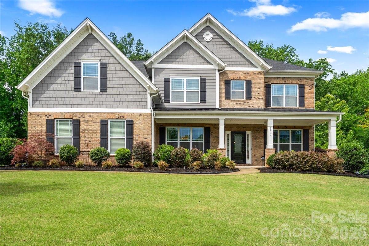 Gorgeous 5 bedroom/4 bath residence gracefully positioned on a private, wooded 0.34 acre lot within the highly sought-after, amenity-rich Summerwood community. A welcoming covered front porch sets the tone, opening into an elegant interior where rich hardwood flooring spans the light-filled, open-concept main level. The expansive living room, anchored by a striking brick fireplace, flows effortlessly into the kitchen, dining area and sunroom, creating a seamless environment for both everyday living and elevated entertaining!At the heart of the home, the thoughtfully designed kitchen impresses with stainless steel appliances, soft-close drawers (throughout the home), a generous center island with seating, abundant cabinetry and prep space, and a timeless subway tile backsplash. The main level is further enhanced by a formal dining room, a private office with French doors and a well-appointed guest suite with a full bath, ideal for visitors or multigenerational living.Upstairs, a versatile flex space offers endless possibilities, complemented by 4 additional bedrooms including a serene primary retreat. Privately situated, the primary suite features tray ceilings, 2 spacious walk-in closets, and an enviable en-suite bath with a soaking tub, dual sink vanity and a beautifully tiled walk-in shower. Secondary bedrooms are generously sized and share two full baths, while a dedicated laundry room adds everyday convenience.Outside, you'll find an exceptional outdoor living experience, complete with a fully equipped kitchen featuring a built-in grill, mini refrigerator and bar seating. The extended patio provides ample space for dining and gathering, highlighted by a fire pit area overlooking a tranquil wooded backdrop, offering the ideal setting for year-round enjoyment.Residents of Summerwood enjoy access to an impressive array of community amenities, including a clubhouse, resort-style pool, playground, scenic pond and walking trails, offering a lifestyle of comfort, connection and convenience!