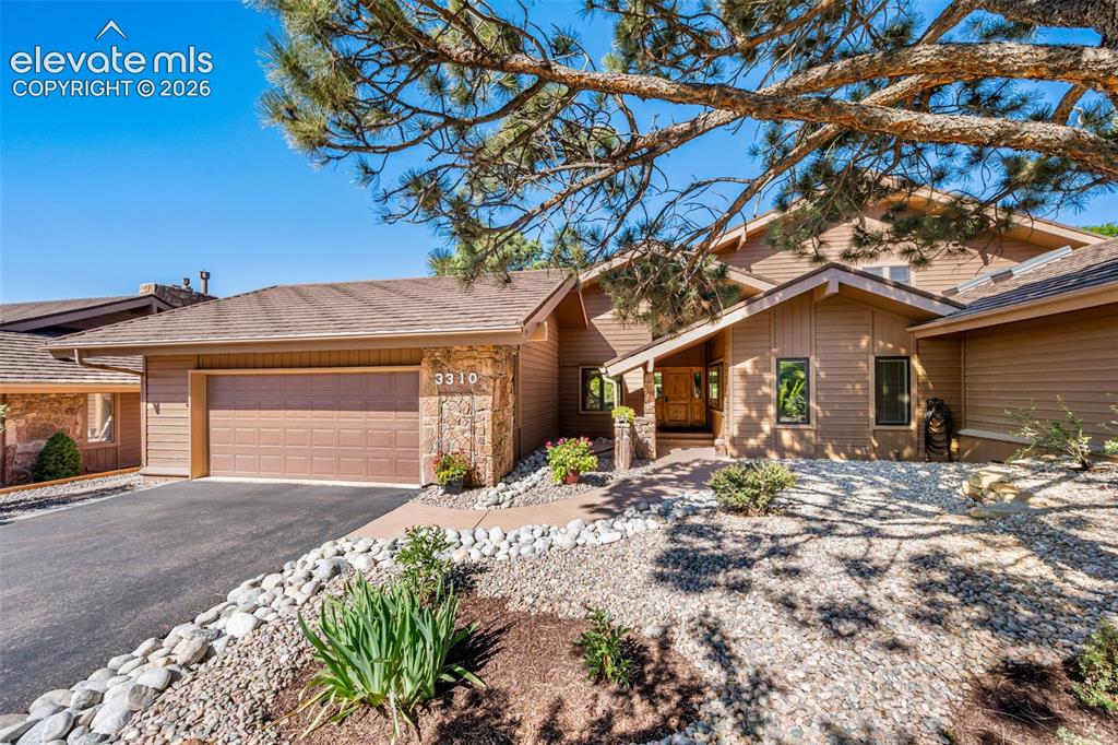 Located inside the gated community of Kissing Camels and backing directly to the golf course, this beautifully remodeled home delivers UNOBSTRUCTED, panoramic views of Pikes Peak and the Garden of the Gods rock formations - truly some of the most iconic scenery in town. Every major living space is intentionally oriented to showcase these breathtaking vistas. The home has been thoughtfully updated throughout with high-end finishes, new and refinished hardwood flooring on the main level, opened and widened stairs with a wrought-iron railing, and expanded and newly poured concrete patios. The redesigned kitchen features custom cabinetry, added storage, a beverage center, wine fridge, and Wolf and Sub-Zero appliances, all centered around a warm walnut countertop that adds richness and character. A dining area sits just off the kitchen and flows seamlessly into the great room, where a fireplace and large windows frame the mountain backdrop. From here, a walkout leads to the large covered patio—an ideal setting for evening dinners, entertaining, or simply watching the sun set behind Pikes Peak. With three en-suite bedrooms, including two primary suites, the layout offers exceptional comfort and flexibility. The upper-level suite is a true retreat with sweeping views, a spa-style bath, fireplace, and spacious walk-in closet. The main-level suite features two walls of windows and a beautifully updated bath. The third bedroom also enjoys a Pikes Peak view, a remodeled bath, and walk-in closet. Additional highlights include a Sonos sound system, extensive new landscaping, fencing around the rear of the property, and an oversized garage with new pull-down stairs for easy attic access and abundant storage. A full list of upgrades is attached.Modern, bright, and exquisitely finished, this home is a rare opportunity to own a fully updated residence with absolutely the BEST VIEW in town. Homes with views like this are limited—don’t miss your chance to make it yours.