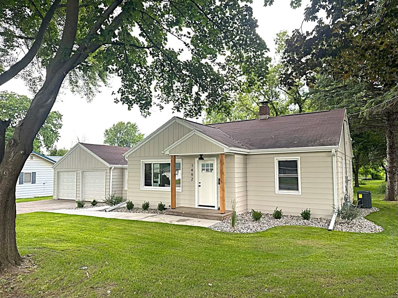Completely remodeled and move-in ready this 2 bedroom 1 full bath ranch home on .93 picturesque acres is sure to impress the minute you walk in! Boasting updates galore this home offers complete interior electrical & service upgrades; a new furnace and central air; brand new bathroom with new tub and tile surround, new vanity, new fixtures and flooring; complete new kitchen including cabinets, counter tops, new flooring, and all new stainless steel appliances; new windows throughout; new lighting throughout; new exterior and interior doors; refinished hardwood floors; freshly painted inside and out; new gutters and downspouts; new sidewalks and patio; very nicely landscaped... The list goes on! The updated breezeway connects the large 2.5 car attached garage. The basement is clean and dry!
