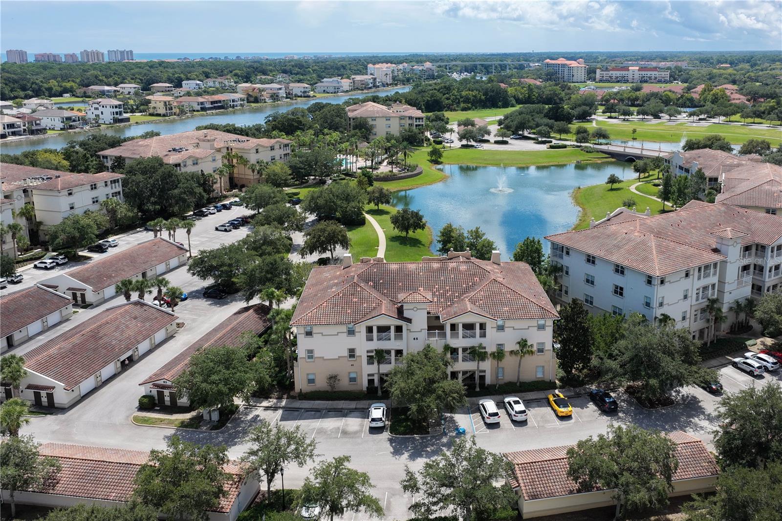 This is the kind of Tidelands condo that makes you want to slow down and stay awhile. Enjoy beautiful pond and fountain views from the screened balcony, with a second-floor location that gives you privacy, elevator access, and an easy connection between the indoor and outdoor living spaces. Inside, natural light fills the comfortable living areas, with granite countertops in the kitchen, a dedicated dining area, and a family room positioned to take in the view. The primary suite offers a versatile sitting area that can easily become a home office or reading space, while both bathrooms have NEW countertops and mirrors. A private 1-car garage adds the storage and convenience buyers want for a vehicle, bikes, and beach gear. Tidelands brings the rest: gated waterfront living, walking paths, Intracoastal access, pools, hot tubs, clubhouse, fitness center, tennis, pickleball, and more—all less than 2 miles from the Atlantic Ocean. Come see this one before someone else does!