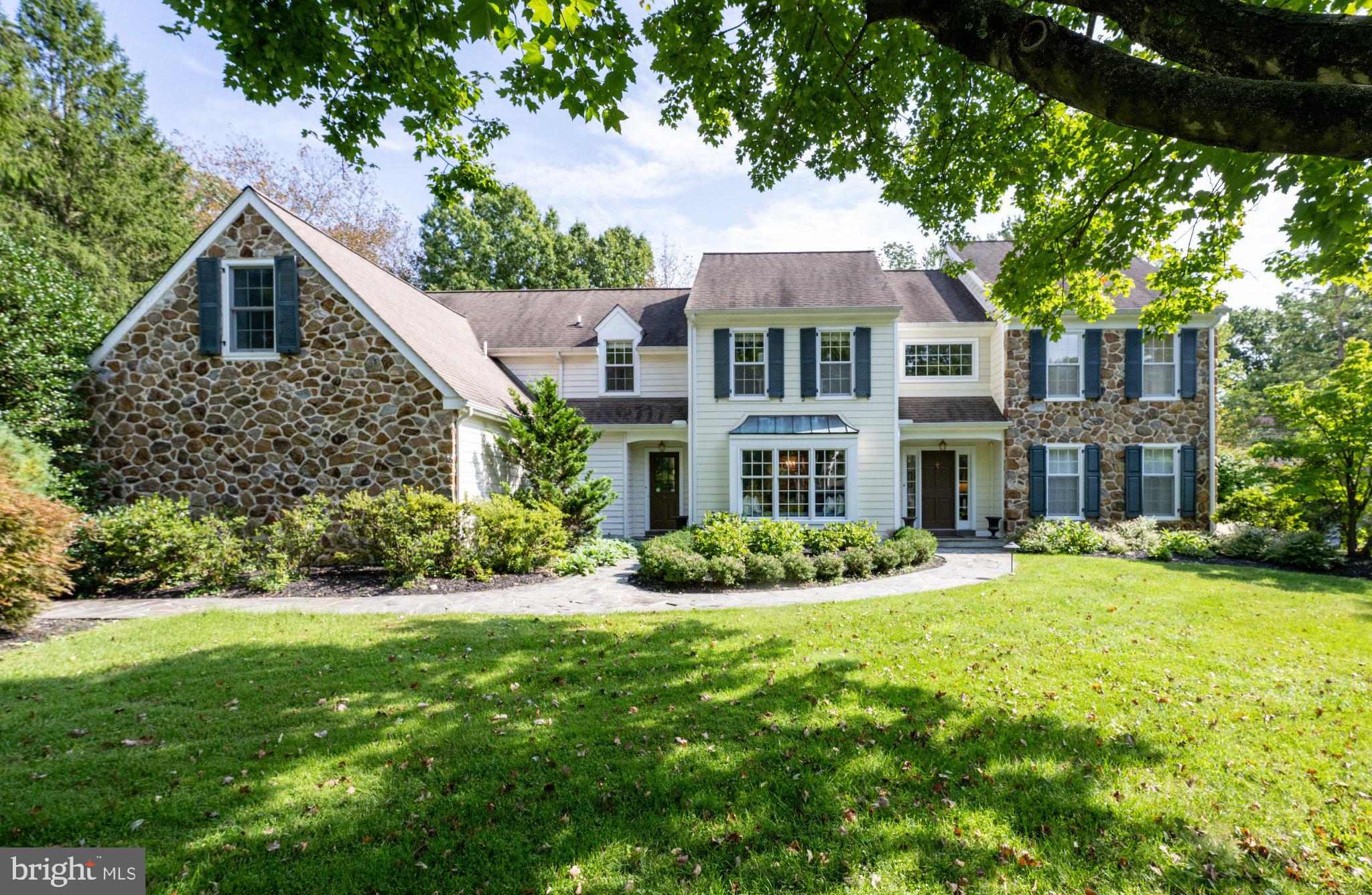 Welcome to 404 Chester Rd, Devon. Nestled within the prestigious estate section of Devon, set on a beautiful lot on a cul-de-sac, this house is an exceptional stone Colonial offering timeless elegance and an ideal setting for refined living. Built by Bernie Dreuding, this distinguished home has been thoughtfully enhanced and updated by the current owners. The result is a seamless blend of classic architectural character and modern sophistication. The kitchen, mudroom, and butler’s pantry were completely renovated in 2023 by Buck Ridge, creating a beautifully appointed heart of the home designed for both daily living and effortless entertaining. The home offers an impressive array of living spaces, including a formal dining room, formal living room, family room, and an additional large rear family room—providing flexibility for both entertaining and every day living. Refinished hardwood floors extend throughout the residence, adding warmth to the gracious interiors. Five bedrooms, three full bathrooms, and two powder rooms provide comfortable accommodations for family and guests. The second floor features a large, light filled primary bedroom, with large ensuite bathroom. Four additional bedrooms complete the second floor and are serviced by two full hall bathrooms. The backyard of this house is not to be missed. The screened-in covered porch offers a peaceful retreat for morning coffee, while a pergola-covered dining area creates a perfect setting for alfresco entertaining. The expansive flat lot also features a private swimming pool. Located in the award-winning Tredyffrin/Easttown School District, this house presents a rare opportunity to own a gracious property in one of the Main Line’s most sought-after communities.