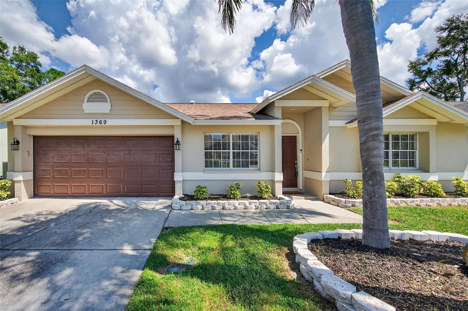 WELCOME TO YOUR MODEL PERFECT HOME at 1369 Stonehenge Way, Palm Harbor, FL in the well-established neighborhood of Wexford. This EXPERTLY REMODELED home with nearly 2100 sqft features 3 bedrooms, 2 bathrooms & 2 car garage in a NO FLOOD, NON EVACULATION ZONE, NO CDD & LOW HOA. You'll LOVE the REFRESHING SWIMMING POOL within the screened lanai extending the length of the home of 50 ft & newly rescreened in Winter 2024. Key exterior features are tropical landscaping highlighting SUPERB curb appeal including MAJESTIC palms, BRAND NEW water heater (2025), newer AC (2021), fully replaced shingle 3-dimensional roof (6/2017), double-wide driveway & no rear neighbors. Stepping inside, you'll LOVE the SERENE freshly-painted, neutral paint color (Fall 2024), HIGH ceilings & STUNNING wide-plank LUXURY VINYL floors throughout the home & PORCELAIN TILE in both bathrooms for FLUIDITY of DESIGN (no carpet). All the matching, lighted ceiling fans with remote control have been replaced & MODERN light fixtures updated. SUNSHINE ILLUMINATES the interior adding to the light & bright aura. The FANTASTIC kitchen features professionally resurfaced cabinets with JET BLACK handles, double deep stainless steel sink with gooseneck faucet, Frigidaire Gallery stainless steel appliances including a range that has NEVER BEEN USED, breakfast bar, pantry closet, QUARTZ stone counters that SHIMMER & subway tile backsplash that ties that design together. This PHENOMENAL home has an OPEN FLOOR PLAN consisting of the foyer, kitchen, dining, living & family rooms. The MASSIVE living room is currently set up as the game/party room while the family room is a casual space featuring no popcorn ceilings, plant shelving & triple glass sliders to the lanai. The RELAXING primary bedroom can easily accommodate king-size furniture & has a fan, walk-in closet & en-suite. The RENOVATED primary bathroom is a SENSUAL SPA EXPERIENCE with an HGTV-style HUGE shower with frameless frosted glass panel & marble-look tiled shower floor, EXQUISITE wall tiles with wall insert for beauty products, CONTEMPORARY vanity with plentiful cabinets with soft-close hinges, QUARTZ counter, NEW lights & private toilet room. The plumbing is present if the new owner wants to add a free-standing bathtub. In this POPULAR split bedroom plan, the secondary bedrooms with full bathroom are found on the opposite wing of the home & each have a fan & ample closets. The guest bathroom which doubles as the POOL BATH features a matching vanity and tiled tub/shower combo which has been FRESHLY reglazed (8/2025). There is a convenient linen closet in the hallway. There is DEDICATED laundry room off the garage with washer & dryer machines included in the sale. In the sweet garage, you'll find a refinished epoxy floor, side door exit & attic access. MORE THINGS to LOVE about this home: LED recessed lights, high custom baseboards throughout the home, fenced yard on 3 sides that would only need gates to make it fully-fenced & no rear neighbors. Your STELLAR HOME is about 4 miles away from Honeymoon Island, near the famous Pinellas Trail & close to downtown Dunedin which offers plenty of restaurants, shops, festivities & tourist attractions right next to the Gulf of Mexico. MAKE THIS YOUR FUTURE HOME!!