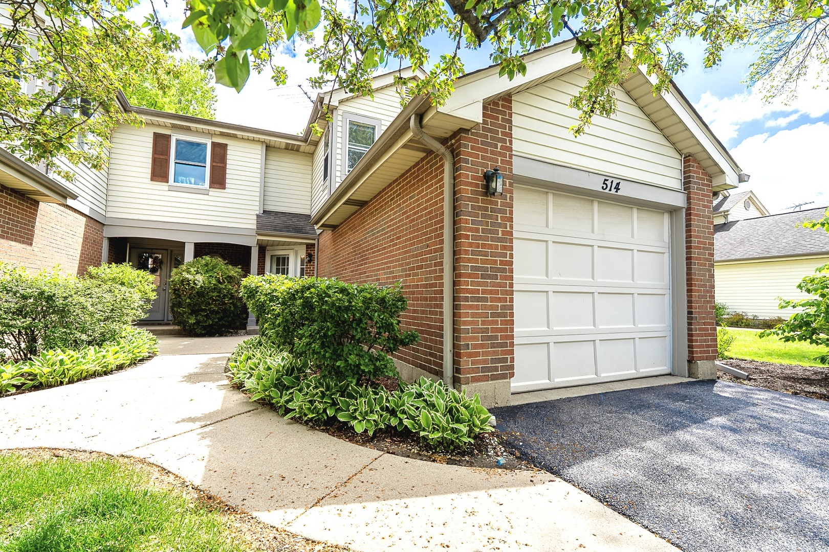 Rare opportunity in the highly desirable Windgate Townhome community! This thoughtfully designed 2 bed, 2.5 bath townhouse features hardwood flooring throughout, upgraded kitchen with stainless steel appliances, fireplace and access to private patio for outdoor grill. Upstairs, you have two large bedrooms with plenty of storage and attached bathrooms and convenient laundry room.     This end unit offers enhanced privacy- it comes with a private driveway (only 4 out of 76 units have it). 514 E. Wingate Court offers a tucked-away peace that feels a world apart while being incredibly central. Unbeatable location, location, location-just minutes to major highways, approximately 13 minutes to O'Hare International Airport, and close to shopping and dining including Woodfield Mall, and Ikea. Enjoy the convenience of grocery stores just a short walk away, along with nearby parks such as North School Park. Located within Community Consolidated School District 59 and Township High School District 214, this home offers strong long-term value. With its central location, unique features, and investment potential-further supported by the proposed Chicago Bears stadium Arlington Heights-this is an opportunity not to miss.