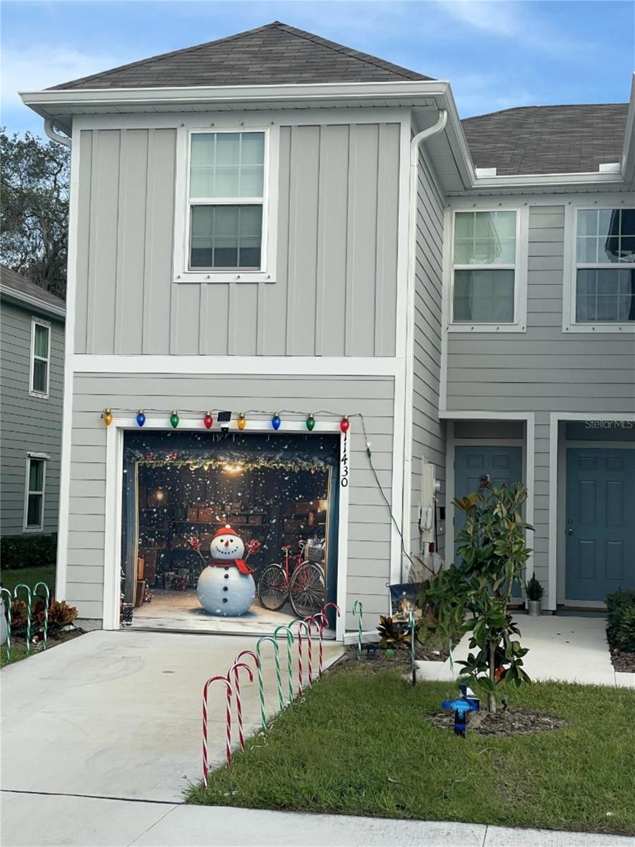 Welcome to 11430 Spectacled Drive, your end-unit retreat in the Bear Creek Subdivision in New Port Richey, Florida -where low-maintenance living meets that fresh Florida edge. Built in 2025, this like-new three-bedroom, two-and-a-half-bath townhome villa clocks in at 1,430 square feet of smart, open space: think airy layout with a modern kitchen boasting sleek counters, stainless appliances, and a sunny breakfast bar flowing right into the living room. Up top, the primary suite’s your private perch with master bath stone counters and a walk-in closet, while the other two beds share easy access to the second bath and still another half-bath downstairs. That one-car garage? Tucked neatly under it all, with room for storage and no brutal stairs to the main floor. Step out back to the screened lanai-your ultimate chill spot, gazing straight into serene conservation land for those peaceful wildlife views. No CDD fees here, just a low HOA covering exterior upkeep, cable, and high-speed internet-pure value without the hassle. Minutes from U.S. 19 shopping, Anclote & Pithlachacottee River kayaking and miles of Natural Gulf Coastlines, and those Gulf sunsets everyone raves about. This end-unit gem’s priced sharp for quick move-in. Better than building-come claim your slice today! Like Always; "Call Today & Enjoy Tomorrow"