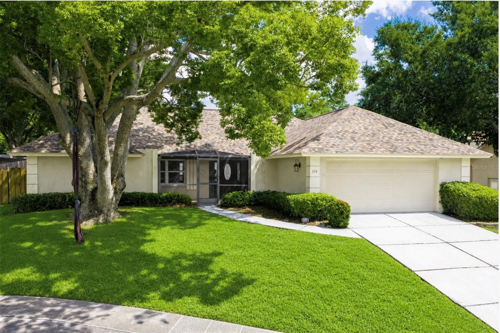 Welcome to your quintessential Palm Harbor, Florida home in the desirable community of Wexford Leas! Nestled quietly on a peaceful cul-de-sac, this beautiful, light and bright, screen-enclosed pool home delivers the ultimate blend of comfort, style, and convenience. From the moment you enter, you are greeted by an abundance of natural light that reflects off the vaulted ceilings and the gorgeous tile flooring that flows seamlessly throughout the main living spaces. The open concept living room serves as a warm gathering place, featuring striking vaulted ceilings, room for a grand sofa, and a cozy wood-burning fireplace - perfect for cooler evenings. For those who love to cook and entertain, the centrally located kitchen is an absolute delight. It is fully equipped with stainless steel appliances, rich, natural granite countertops, solid wood cabinetry, ample space for barstools, and an additional eat-in dining area. A versatile formal dining space sits nearby, offering the flexibility of converting the space into a fourth bedroom, home office, or nursery, depending on your lifestyle needs. The luxurious primary suite is a true private retreat, boasting a vaulted ceiling, an impressive walk-in closet with custom built-in’s, and sliding doors leading to the pool area. The spacious en suite bathroom is complete with a double vanity sink, a deep soaking garden tub, and a step-in shower. Two additional well-appointed bedrooms and a beautiful second bathroom ensure plenty of comfort for family and guests. Practical upgrades include convenient indoor laundry, a versatile garage space, and modern systems like a reverse osmosis water system, newer water heater and water softener. Step outside to the pool and screened lanai to discover your private outdoor escape, featuring stylish pavers with plenty of room for outdoor dining, sunbathing or outdoor activities, all overlooking a wonderfully spacious and fully fenced backyard. Just beyond your property lines, the established community of Wexford Leas offers a neighborhood park complete with a scenic pond, playground, benches, and picnic tables. Best of all is the location, you are zoned for Palm Harbor University High School and a short drive, walk, or bike ride from the Pinellas Trail, Downtown Palm Harbor, the historic Tarpon Springs Sponge Docks, Downtown Dunedin, world-famous Gulf beaches, and the breathtaking shores of Honeymoon Island State Park. With an exceptionally low HOA fee of just $215 per year, this well-connected neighborhood with a strong sense of community is ready for you to call home.