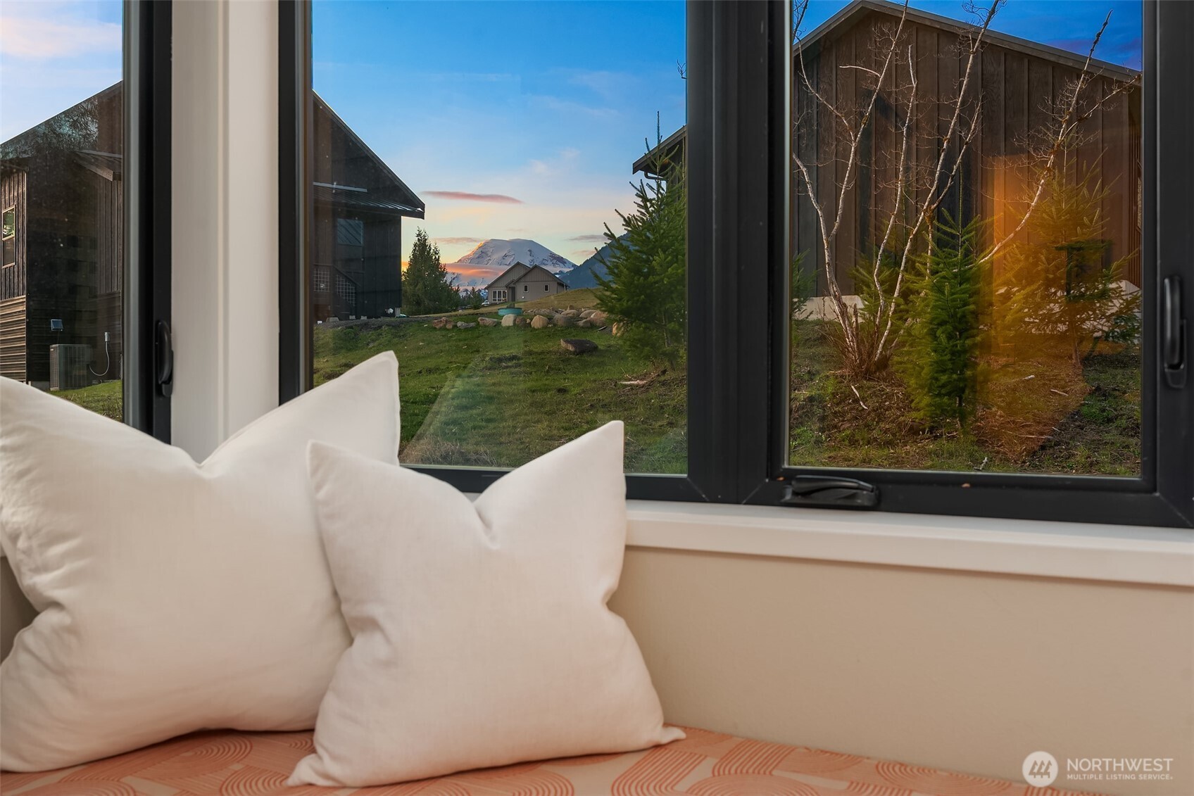 Welcome to the Creekside. Built in 2021, this immaculate modern alpine retreat is located just minutes from town center in Packwood’s premier gated neighborhood, Hideaway. The clean architectural lines and advanced building materials offer the perfect juxtaposition with the rugged natural beauty of Mt. Rainier and the ever-babbling creek safely flowing past the firepit gathering spot. Inside, you’ll love the stunning granite slab as the focal point of the open kitchen and dining area. The seamlessly connected great room features a towering two-story wall of glass looking West down the Cowlitz River Valley and a tremendously efficient Quadra-Fire wood burning fireplace. Both the main level bedroom and second level bedroom offer breathtaking views of Mt. Rainier. The spacious bunk room offers a flexible sleeping area for all ages. A tuck-under garage is ideal for storing your outdoor recreation equipment and includes an EV charger for you or your guests to reenergize before enjoying another adventure in the Gifford Pinchot National Forest. Pre-inspected and offered fully furnished, this home is the perfect turn-key STR with which you can realize a swift return on investment as the ski season approaches. Located only 25 minutes from the National Park and White Pass Ski Area, the Creekside is your base camp to the Cascade Mountains.