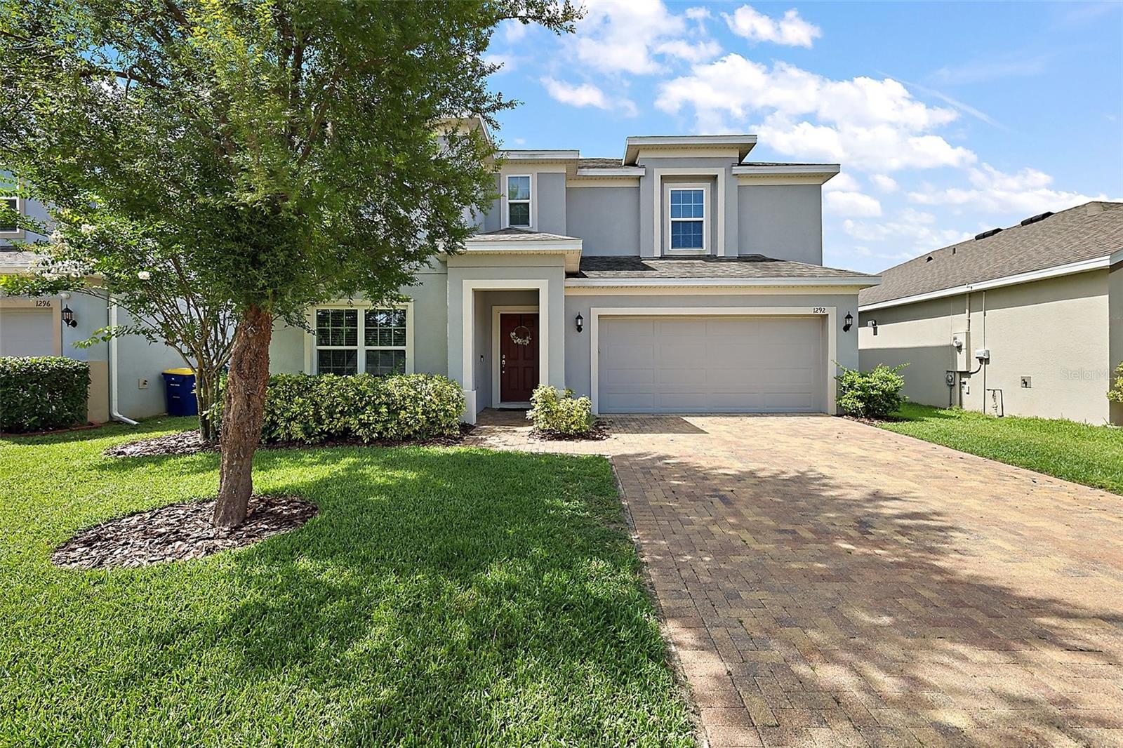 Fantastic 2019 built home in popular Ardmore Reserve in Minneola! Well kept 2560sqft, 4 bedroom, 2.5 bathroom home with 2 car garage. Built by Hanover (now Land Sea), the popular New Castle model has a great layout for entertaining. Formal living/bonus room just off the entrance is perfect for a large home office. Kitchen with gas stove and granite counters has a large walk in pantry with plenty of storage. Kitchen opens to the family room and sliders lead to the covered patio and fenced in back yard with no rear neighbors. Upstairs features a large bonus area/loft, and all bedrooms. Primary bedroom is large and primary bathroom features a walk in shower, double sinks, and a big closet. Ardmore amenities include a zero-entry resort style pool with cabana, splash pad, and playground. Access to the South Lake Trail system is just outside the community. Tons of dining, shopping, grocery, hospital, and retail options nearby.  Turnpike is 5 minutes away giving you a sub 30 minute commute to Orlando.