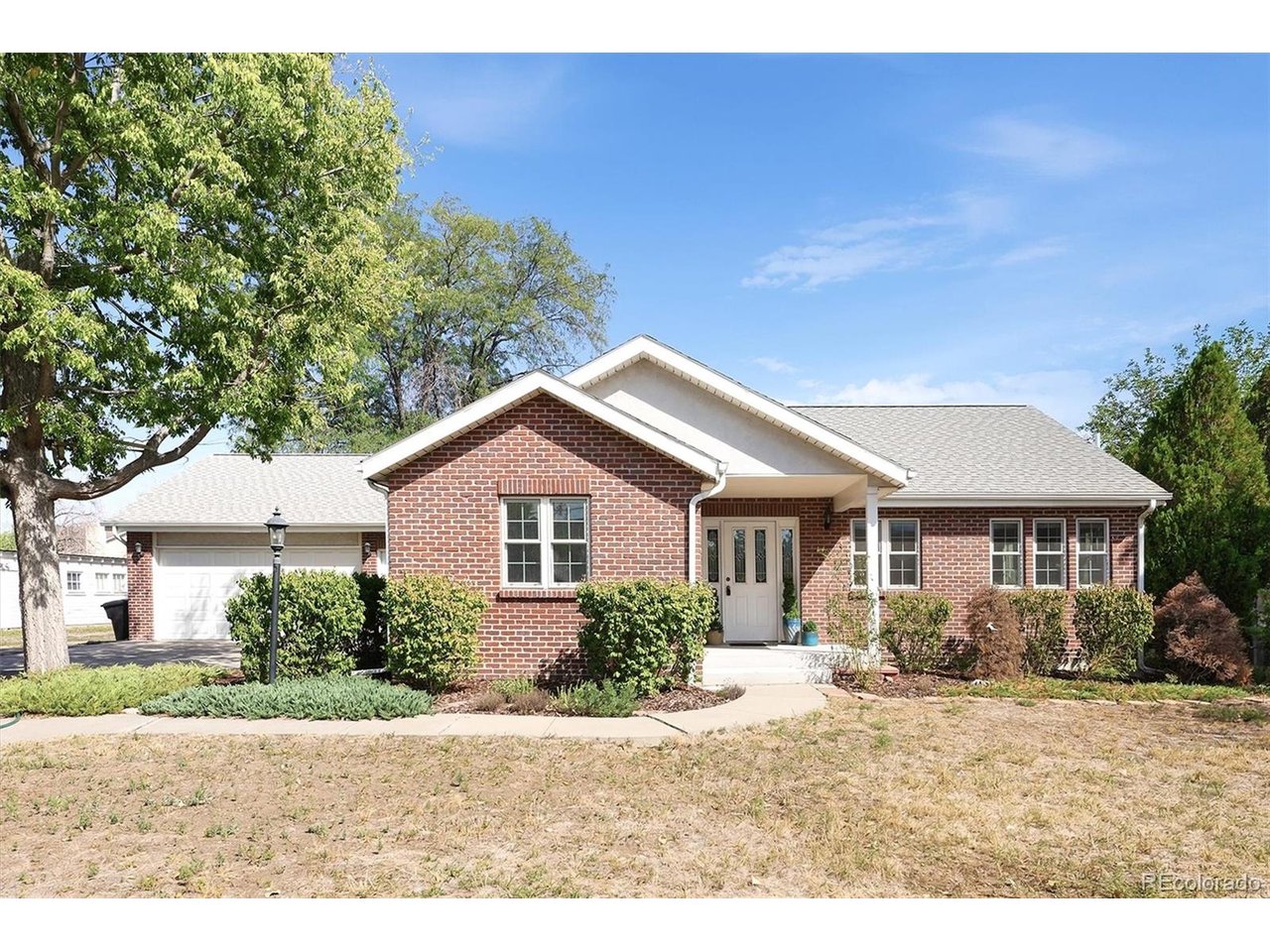 Tired of neighbors 10 feet away? Looking for your own urban farmhouse? Need tons of space for your toys? Then look no further! This fantastic ranch estate is your oasis in the heart of the city! Complete with water rights, over an acre of space, tons of garage and barn space, not to mention a beautifully remodeled home! Featuring 4 large bedrooms, a sunny home office, finished basement, large mudroom, 5 garage spaces, and much more. This one is updated perfectly while keeping its original character. Flooded with natural light, the chefs kitchen boasts cherry cabinets, stainless steel appliances, a huge island, a large breakfast nook, and gleaming hardwood floors. An inviting living room welcomes you with a wood burning stove, tons of sunlight, a sun room and plenty of space to spread out. The private primary suite is complete with vaulted ceilings, a large walk in closet and a spa like bathroom. With so many incredible features, this one needs to be seen in person to capture it all! Surrounded by countless lakes, trails, and parks while conveniently located close to shopping, restaurants and night life. Head out and enjoy everything or take refuge in your private back yard. An incredibly rare opportunity for private living in the city. This one feels like home!