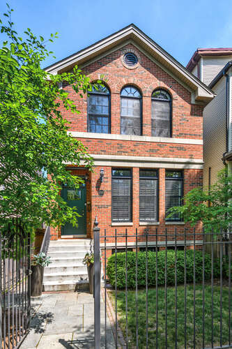Prime Roscoe Village Location! This perfect floor plan will check every box and offers 5 BEDROOMS and 3.1 baths! The beautiful living room boasts custom, floor-to-ceiling built-in bookshelves and a wood burning fireplace and opens to a cozy dining room. The well-appointed kitchen has a perfect nook for a table AND a separate bar area AND a pantry AND broom closet, plus Viking/Subzero appliances including a double oven and cookbook nook. There is also a mini-mud room by the back door to hide shoes & store coats. The grand primary suite has vaulted ceilings and three professionally organized closets. Bedrooms 2 & 3 are both spacious and bright. The lower level has a large family room with an additional fireplace, wet bar, and two additional bedrooms - perfect for guests and a home office or exercise. Two laundry centers - one on the top floor and the other on the lower level! Outdoor space is ample including a blue stone front patio with low maintenance plants, a grill/bistro nook off the back door, grassy back yard with irrigation system and a gorgeous garage roof deck with a pergola and planters. Walkable location on tree-lined Bell Street in the Audubon School District and just steps from Lane Tech, shopping, dining, night life and transport.
