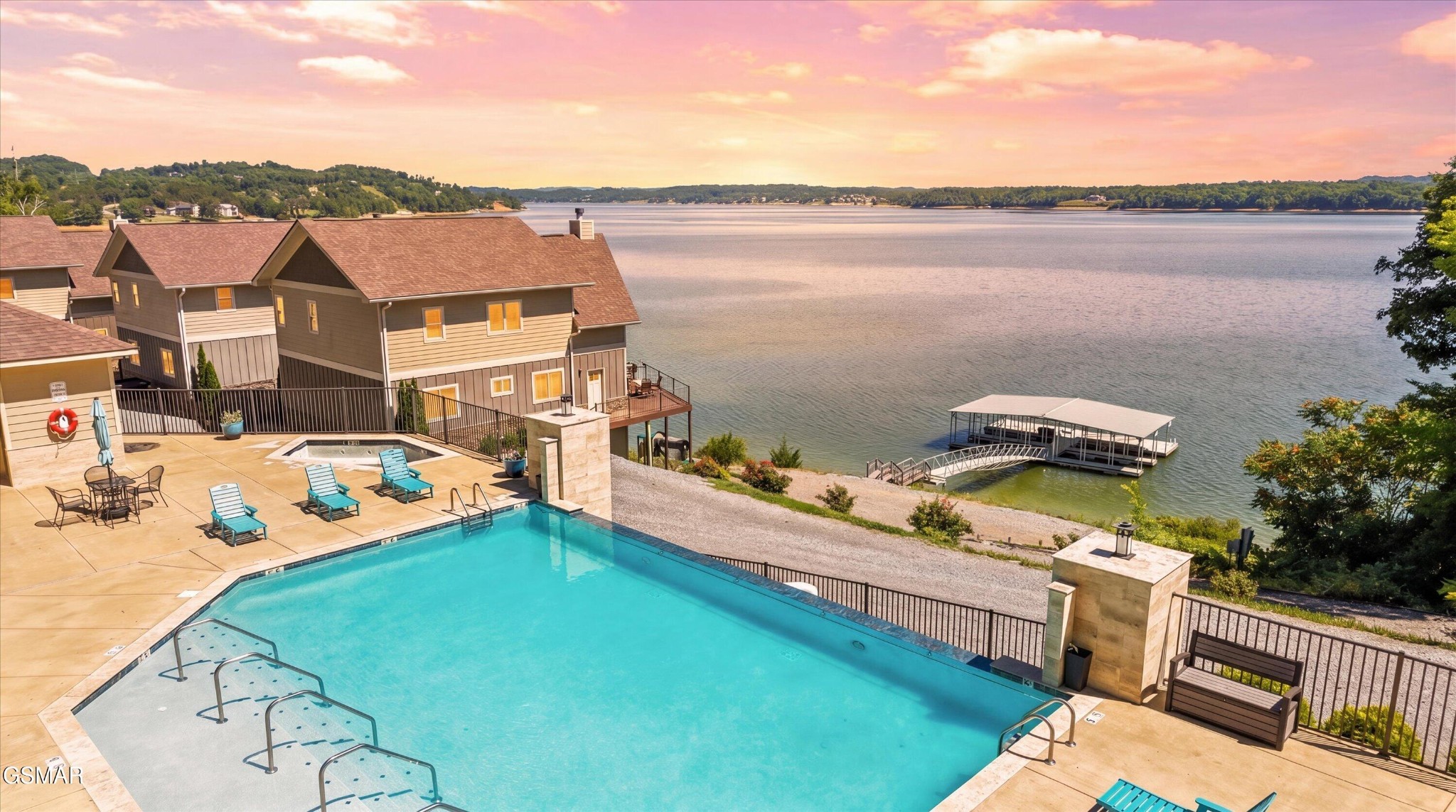 Opportunities to acquire a fully operational waterfront resort with this combination of scale, infrastructure, and future development potential are exceptionally rare. Set on nearly 30 acres with almost 2,000 feet of Douglas Lake shoreline, this commercially zoned resort features 41 bedrooms, 34 bathrooms, and 22,000+ square feet of furnished accommodations across six luxury waterfront properties. With city sewer, internal roads, electric service, and development-ready areas already in place, the property is well-positioned for future growth. Combining immediate income with long-term upside, this offering represents one of East Tennessee's most compelling resort investments.At the heart of the resort stands a three-story timber frame lodge spanning nearly 6,000 square feet. This fully furnished cabin features 6 bedrooms, 6.5 bathrooms, and accommodates up to 16 guests. Outfitted with custom Amish furniture throughout, the lodge delivers the warm atmosphere guests seek when visiting the Smoky Mountains. Expansive gathering spaces and rich timber accents create the perfect setting for families, weddings, retreats, and special events. While serving as a premier luxury rental today, the lodge also offers flexibility as a future hospitality center, event venue, culinary hub, or operational headquarters.Complementing the lodge are five waterfront villas, each offering 3,200+ square feet, 7 bedrooms, 5.5 bathrooms, and accommodations for up to 18 guests. These homes showcase soaring ceilings, custom cherry wood finishes, bamboo hardwood flooring, expansive kitchens with oversized islands, floor-to-ceiling stone fireplaces, and panoramic views of Douglas Lake from every level. Wraparound decks place guests directly above the water, immersed in the beauty of Douglas Lake.Collectively, the resort can accommodate well over 100 guests, making it ideal for family reunions, weddings, corporate retreats, church groups, sports teams, and destination events.