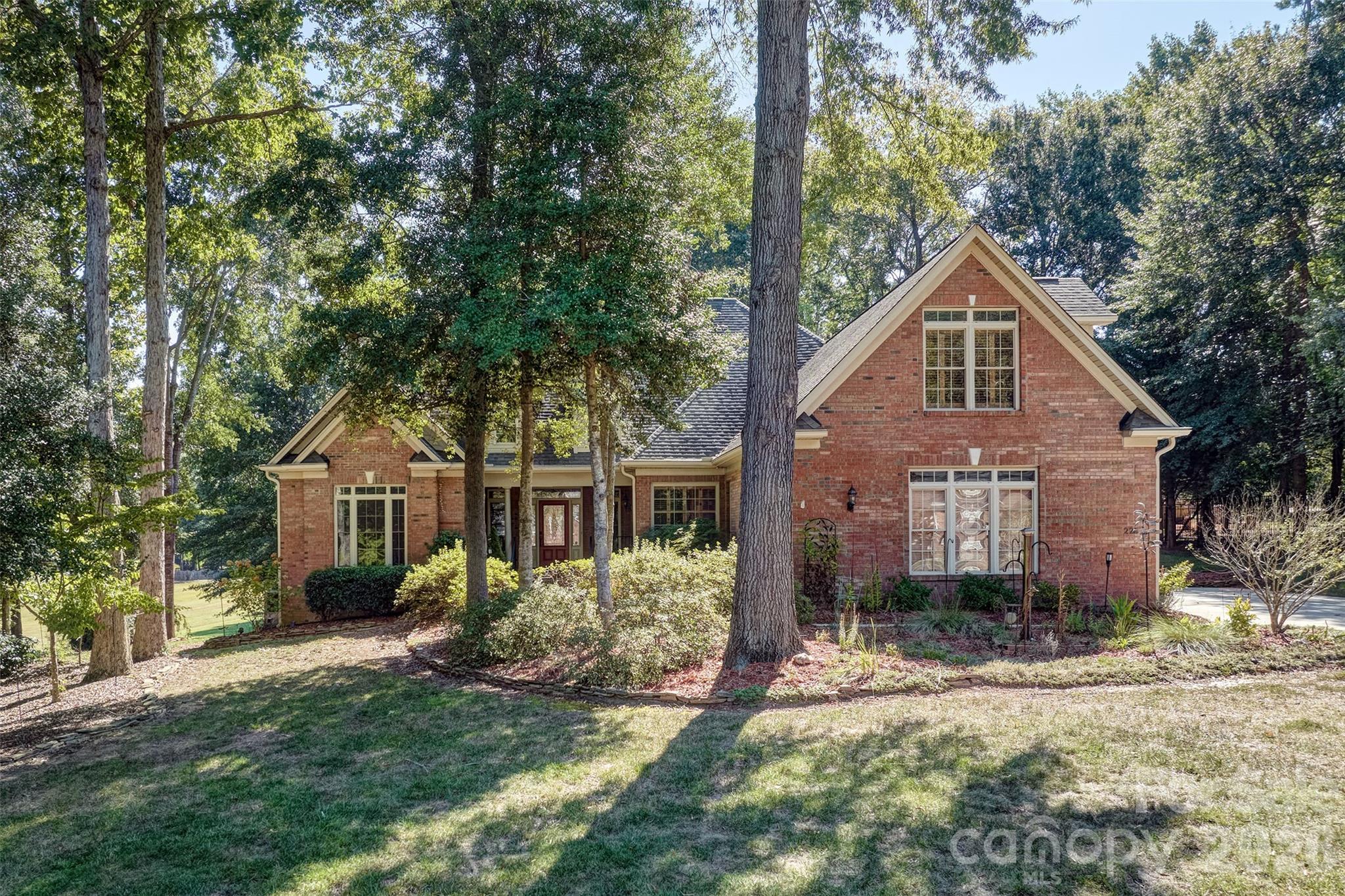 Welcome home to this all brick custom home in Lake Wylie and close to everything!  Minutes to the lake and 2 different boat access areas. Wonderful small neighborhood with log cabin club house and large field for recreation and walking trails!  This beauty boasts an open floorplan that combines the great room with cathedral ceiling including built ins and fireplace , kitchen with eat in dining area and bar for stools, dining room with coffered ceiling and front entry way that welcome you in!   The large primary bedroom has so many windows for all the natural light to come in and remodeled primary bathroom has soaking tub , zero entry shower and dual vanities.  2 more secondary bedrooms and a full bathroom complete the first floor along with big laundry /mud room.   True ranch living with only 2 steps in from the garage that has a work sink.  This home could be handicap accessible if needed with few tweaks.  Upstairs opens up all the possibilities of multi generational living .  Could be a mother in law/teen suite with sitting room or oversized bonus , bedroom area that easily be framed in for privacy and full bath.  Home could be 4 bedrooms and offers tons of walk in attic storage.  Or make it pool table man cave room or media room.  So many ideas!  The screen porch with TV in place beckons you to enjoy the outdoors.  There is also a great additional trex patio off the porch for entertaining and grilling. Over 1/2 acre lot.  Large green space next to the house for additional room to run and play!  The seller is offering $5000 in rate buy down or closing costs with acceptable offer.  Home is convenient to Charlotte International airport - 35 minutes, easy commute to Charlotte, Fort Mill, Belmont, Gastonia, Clover and Rock Hill.    all this and in the award winning Clover School District.  New road work/traffic light  and 4 lane highway to get home now!  Welcome to the Lake Wylie area and all it offers for recreation close by!