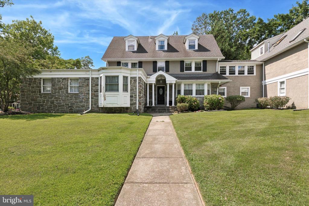 Step into a world of unparalleled luxury at 140 North Rolling Road in Springfield, Delaware County. This meticulously designed estate boasts 6,300 sq ft, positioning it among the largest and most prestigious residences in the area—a true testament to opulence and modern innovation.Upon arrival, you are greeted by expansive, professionally landscaped grounds and a striking colonial-inspired façade. The timeless grandeur combines seamlessly with contemporary curb appeal, setting the tone for what lies within.Inside, exceptional interiors and custom craftsmanship are found throughout. There are six bedrooms and four bathrooms, each lavishly appointed for serene privacy, abundant storage, and spa-like finishes. Every detail has been thoughtfully designed.The light-filled living spaces feature soaring windows that illuminate an open-plan living, dining, and family area, all enhanced by hand-laid hardwood floors and exquisite custom millwork. The gourmet kitchen, centered around a grand quartz island and farmhouse sink, is equipped with premium stainless steel appliances and artisanal cabinetry—a perfect setting for both entertaining and culinary creativity.The sumptuous primary suite offers a tranquil sanctuary, featuring a palatial bedroom with expansive walk-in closets. The oversized master bathroom is unfinished and awaits the new owner's personalized customization.  Multiple dedicated home office spaces, a cozy library, a game room, and a versatile playroom cater to every modern lifestyle.  State-of-the-art technology, including advanced climate control and energy-efficient systems, ensures both sustainable luxury and peace of mind. The prestigious setting provides tranquil suburban living with immediate access to elite schools, boutique shopping, fine dining, and vibrant recreational options. Conveniently located just minutes from major highways and transit hubs, Philadelphia is only a short drive away.More than just a residence, this exceptional estate offers a modern lifestyle retreat that elevates daily living into a private sanctuary of inspiration. Discover refinement, versatility, and limitless possibilities at 140 North Rolling Road. Schedule your exclusive tour to experience the pinnacle of Springfield luxury—your dream home awaits where brilliance meets bespoke craftsmanship.