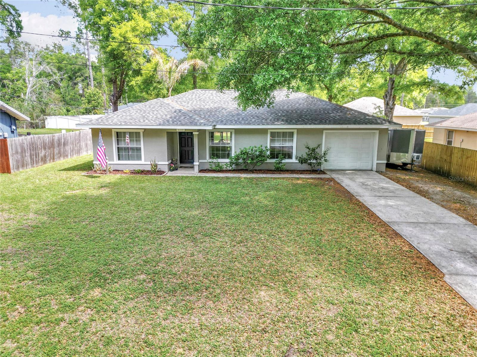 New 2025 roof and 2020 AC on this 3-bedroom, 2-bathroom split floor plan home on 0.24 acres in northwest Ocala. LVP flooring runs throughout the entire 1,266 sq ft open layout — no carpet anywhere. The split bedroom design places the primary suite separate from the two additional bedrooms, and the 1-car garage adds covered parking and extra storage. A whole-home water softener system is included. No HOA fees and no CDD assessments keep monthly costs low. Located approximately 2.5 mi from Publix on NW Blitchton Rd, 3.0 mi from the World Equestrian Center, and under 3 mi to I-75 via Hwy 40 — positioned close to northwest Ocala's dining, shopping, and year-round equestrian events. Includes interactive 3D tour.