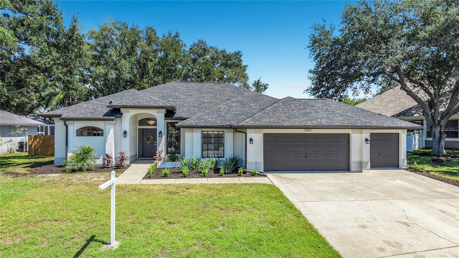 Welcome to this completely remodeled and absolutely stunning move in ready home located in the highly sought after Pipers Meadow! This exceptional property offers 4 bedrooms, 2.5 bathrooms, and a spacious 3 car garage on an oversized lot. From the moment you arrive, you will appreciate the gorgeous curb appeal. As you walk inside, you will notice the elegance and thoughtful design of the home. Luxury vinyl plank flooring flows throughout the entire home. The spacious split floor plan is perfect for everyday living and spending time with friends and family. The open living and dining area flows easily into the spacious kitchen and family room creating the ideal layout. Also with a completely custom built in bar and sitting area, it is the perfect space for entertaining. The guest bathroom was designed to stand out with custom tile and beautiful fixtures. The gorgeous updated kitchen is a chef’s dream showcasing quality custom cabinetry, quartz countertops and backsplashes, 10' long island with plenty of extra storage, coffee nook and brand new high end appliances. The primary suite features it's own oversized luxurious bathroom, with walk-in closet, dual vanities, floating tub and a custom designed walk in shower. A space designed to relax. Step outside to your tropical paradise, including a private pool bathroom and outdoor shower. Featuring a large in ground swimming pool and newly resurfaced patio with plenty of space to relax and entertain while enjoying your privacy. Upgrades include, new ROOF 2026, new HVAC 2026, new appliances 2026, newly rescreened lanai, new washer and dryer 2026, new flooring, fans, lighting and hardware throughout. Pipers Meadow is a highly desirable community offering wonderful social activities including block parties and holiday events. Conveniently located just minutes from Honeymoon Island State Park, local beaches, the Pinellas Trail, shopping, dining, and top rated schools including Palm Harbor University High School and Palm Harbor Middle School. Schedule your showing today. This one won't last!