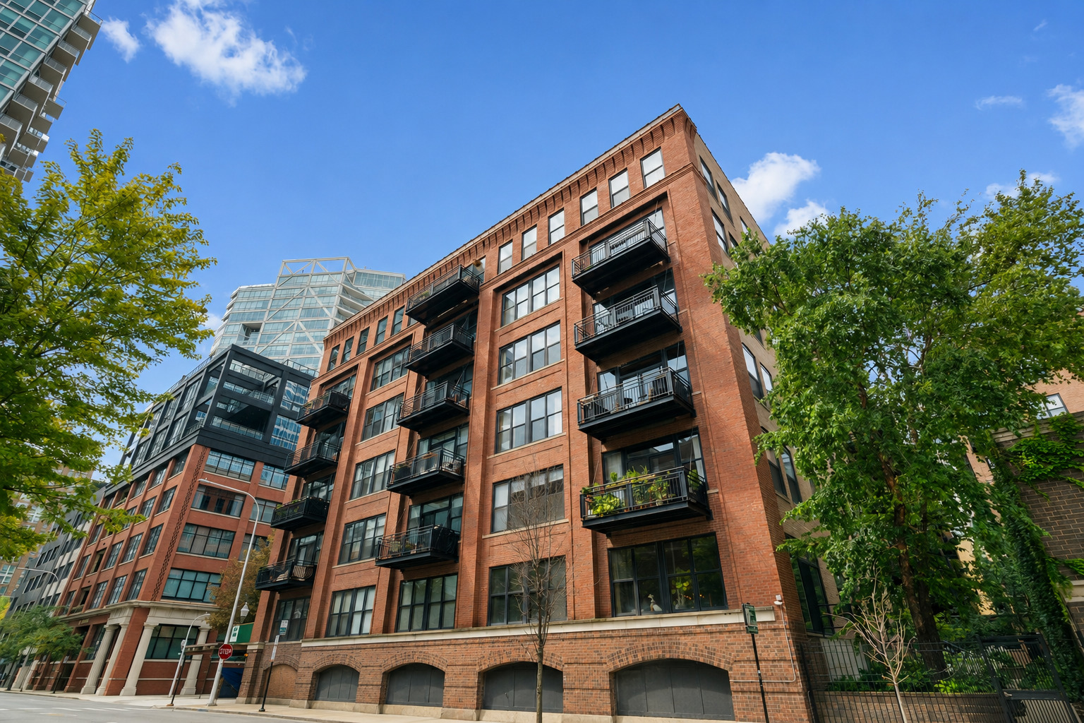 The River North home you've been waiting for! This stunning two bedroom, two bath penthouse duplex loft delivers dramatic architectural character, an expansive open floor plan and two outdoor spaces with gorgeous skyline views day & night. Soaring ceilings, exposed brick, timber beams, oversized windows and hardwood floors capture that authentic city feel. The open living space is built for entertaining with spacious separate living and dining areas, a cozy gas fireplace and a chef-ready kitchen with new stainless steel appliances, abundant cabinetry and a large breakfast bar for casual gatherings. The oversized primary suite is a true retreat with abundant space, large windows that fill the second floor with natural light, direct roof deck access, generous closets including a walk-in, and an updated spa-like bath featuring a double vanity, separate shower and soaking tub. The second bedroom along with another full bath on the main level offers effortless flexibility, perfect for guests or a home office. The outdoor living space with this unit is breathtaking. Step onto your expansive roof deck, large enough for dining, lounging and entertaining, surrounded by sweeping city views. A second balcony off the main living area adds additional space to entertain or grill outside. Other unit features include in-unit laundry, central heat/air, brand-new carpet & paint throughout and extra storage in building. All of this in the heart of River North, steps from some of Chicago's best restaurants, nightlife, shopping, the Chicago River, Erie Park and consistent neighborhood energy everywhere you go. This is a rare find with true loft character, incredible living space along with exceptional outdoor space and all in one of the city's most coveted neighborhoods. Garage parking is available for additional purchase and must be sold with the unit.