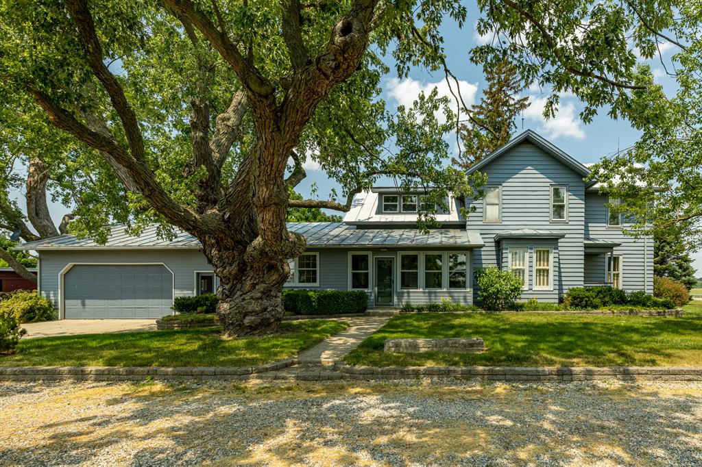 15 sprawling acres of pure rustic charm! The 4 bed, 3 bath, classic farmhouse offers more than 3,000 sq ft of living space where period appropriate elegance seamlessly intertwines with modern updates. The 1900's traditionally built barn offers an immense amount of functional space, historic charm, and future uses. The well maintained granary building offers similar current functionality and future potential. The 80 by 20 foot workshop features reinforced walls, a concrete floor, and a long lasting metal roof. An additional post and beam constructed shed offers another versatile workspace. Outside, you'll find expansive lawn and wooded areas, a bubbling creek, manicured gardens, and so much more.  Don't just buy a property, embrace a lifestyle that's as rich as the soil beneath your feet!