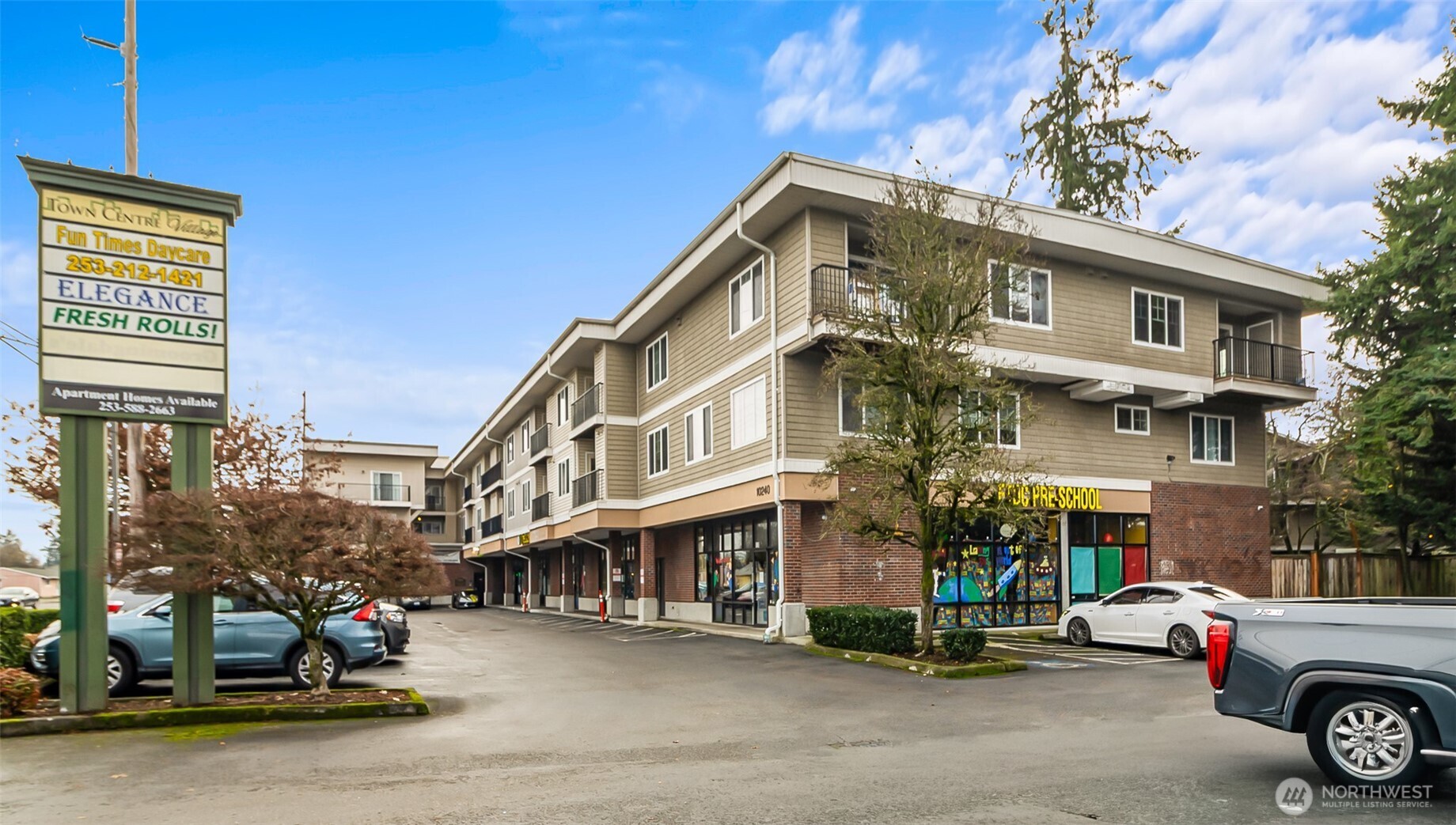 Town Centre Village is a well-maintained mixed-use investment offering a compelling blend of scale, diversification, and modern appeal. The property features 37 spacious residential units with large one- to three-bedroom floor plans, complemented by 13 street-level retail suites that provide multiple income streams. Built in 2005 with expansion in 2017, the asset includes a main elevator-served building as well as a separate townhome-style fourplex. Residential units have been upgraded with contemporary flooring, cabinetry, and finishes, and every unit is equipped with a full in-unit washer and dryer. Retail tenants operate under established NNN leases and benefit from fully served HVAC systems, while on-site amenities include secured 24-hour resident parking, 87 total parking spaces, an on-site daycare, salon, and café—enhancing both tenant demand and long-term stability.     Ideally positioned along high-visibility Bridgeport Way SW, the property offers immediate access to I-5, Tacoma, and Joint Base Lewis-McChord, with Lakewood Towne Center’s retail and dining options just minutes away. The Lakewood Transit Center is located under two miles from the site, further strengthening commuter appeal.