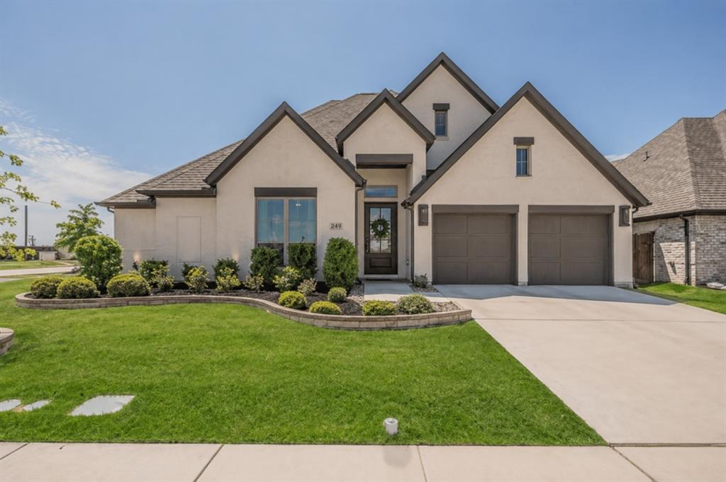 Welcome to this stunning, highly upgraded home featuring over $100K in builder upgrades, a thoughtfully designed open-concept layout, and a desirable split-bedroom floor plan.At the heart of the home, the chef’s kitchen impresses with quartz countertops, an oversized island, a commercial-style 6-burner gas range, a custom hood, full-height designer backsplash, and statement lighting — all perfectly positioned for both everyday living and entertaining.The expansive living space is designed to impress, featuring a dramatic floor-to-ceiling stone fireplace, a beautifully crafted wine cabinet with dedicated counter space, and a premium surround sound system with integrated music for the ultimate entertainment experience. A wall of windows fills the home with natural light and seamlessly connects indoor and outdoor living.Step outside to your extended covered patio, where elevated views and no direct rear neighbors create a private and relaxing outdoor retreat.The secluded primary suite offers a peaceful escape, complete with abundant natural light and a spa-inspired bathroom featuring dual vanities, a soaking tub, and an oversized walk-in shower.A versatile flex space behind elegant French doors provides endless possibilities — perfect as a media room, game room, or home office to suit your lifestyle.A large 3-car garage provides ample storage and parking, complete with a built-in Tesla charger for modern, energy-efficient living.Located in the highly sought-after Ventana community, residents enjoy resort-style amenities including pools, scenic trails, parks, and convenient access to shopping, dining, and outdoor recreation.